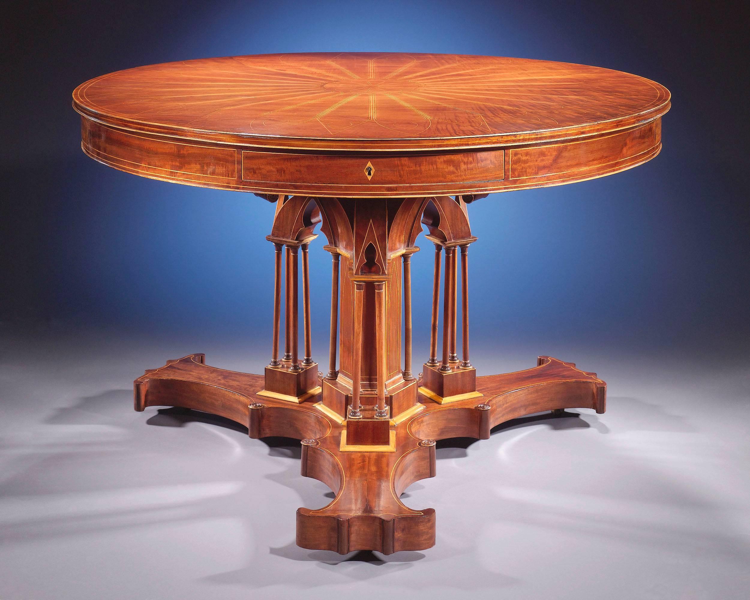 This exceptional Charles X mahogany drum table, attributed to Alphonse Giroux and Company of Paris, a firm celebrated for their small luxury objets d'art and furniture created with precious materials. The table is conceived in the early 19th century
