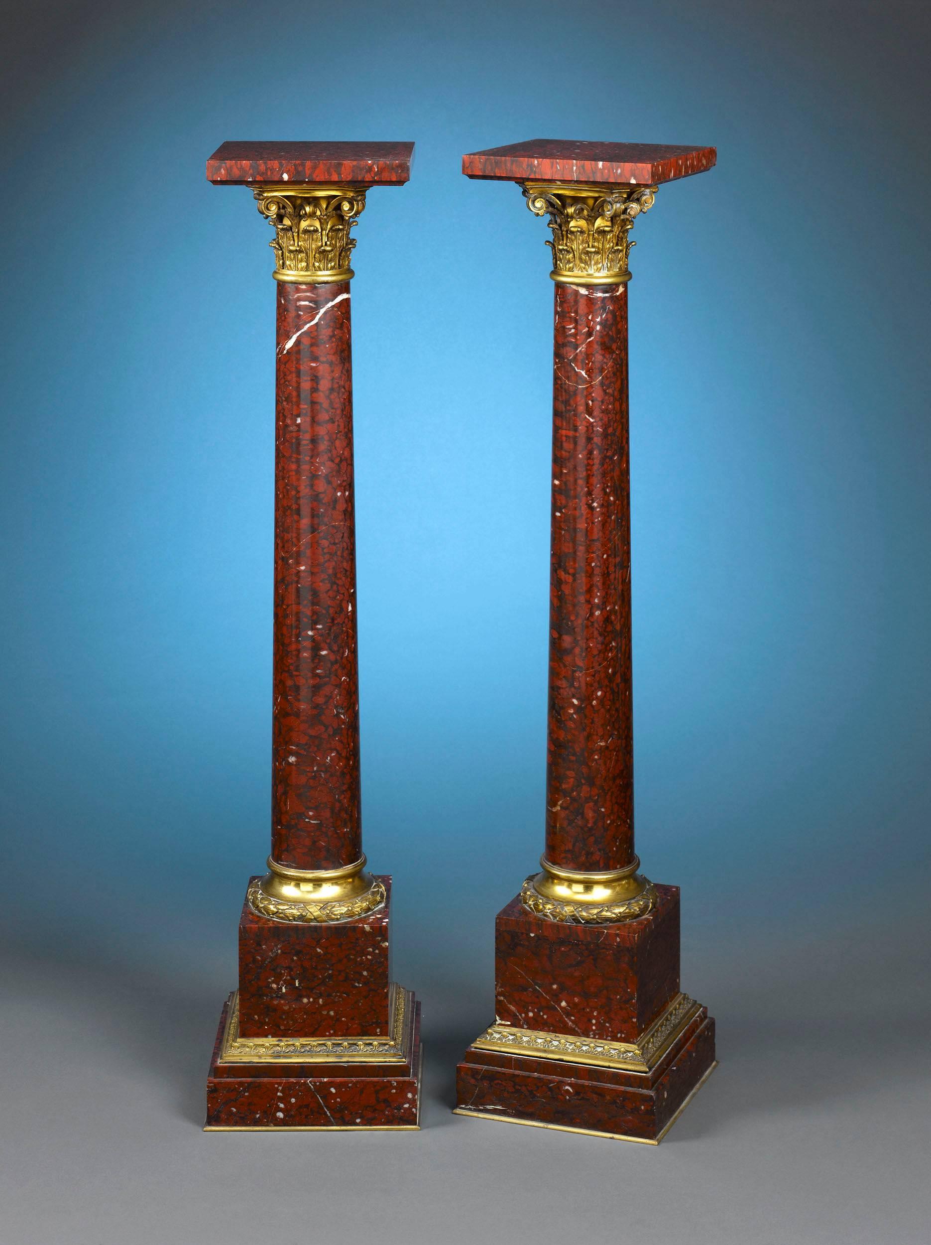 This spectacular pair of marble and doré bronze pedestals is hewn from the finest French 