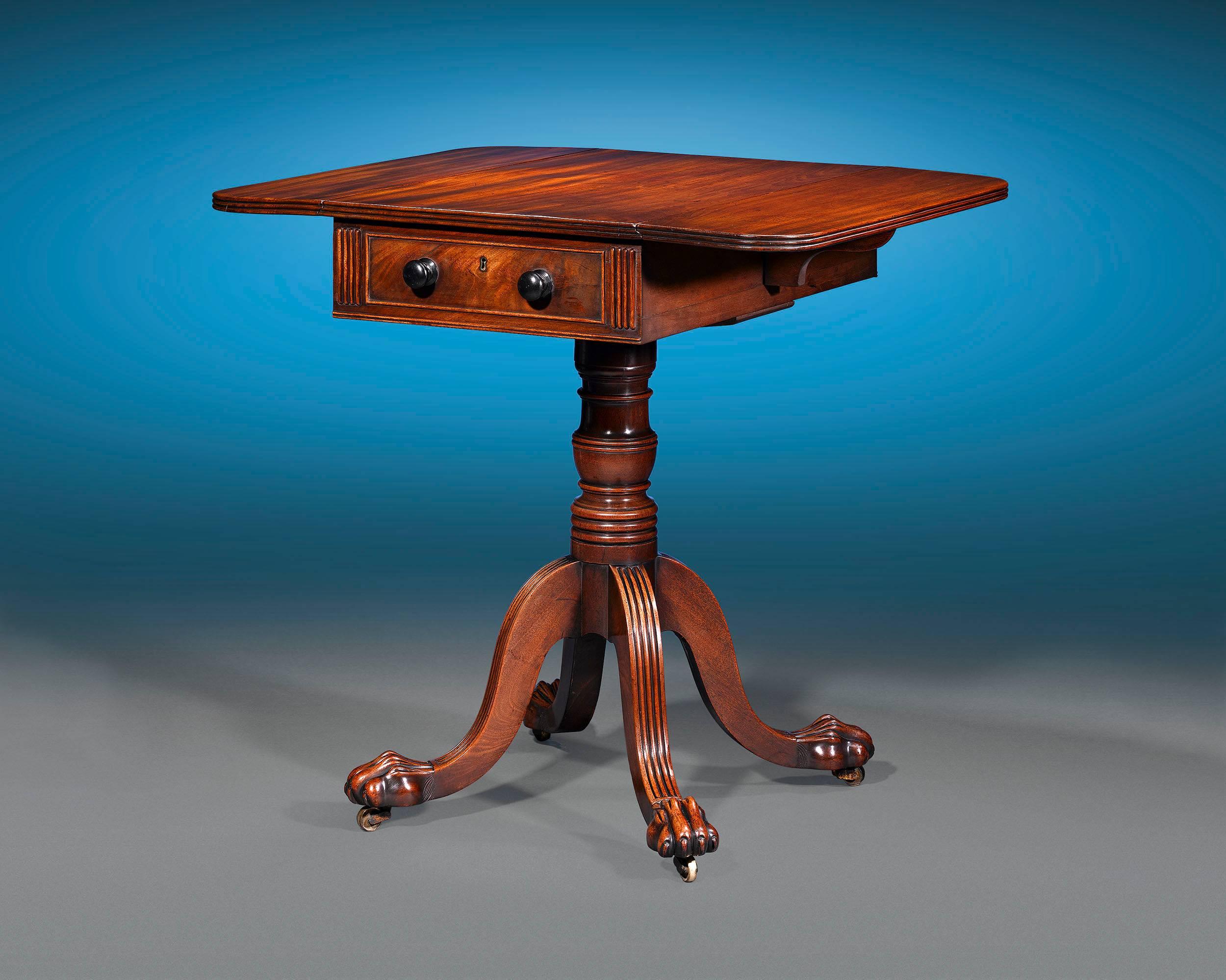 Boasting wonderfully grained and patinated mahogany of the highest caliber, this early Regency-period Pembroke table is attributed to the Gillows firm of Lancaster, England. From the quality of the mahogany and perfect proportionality, to the
