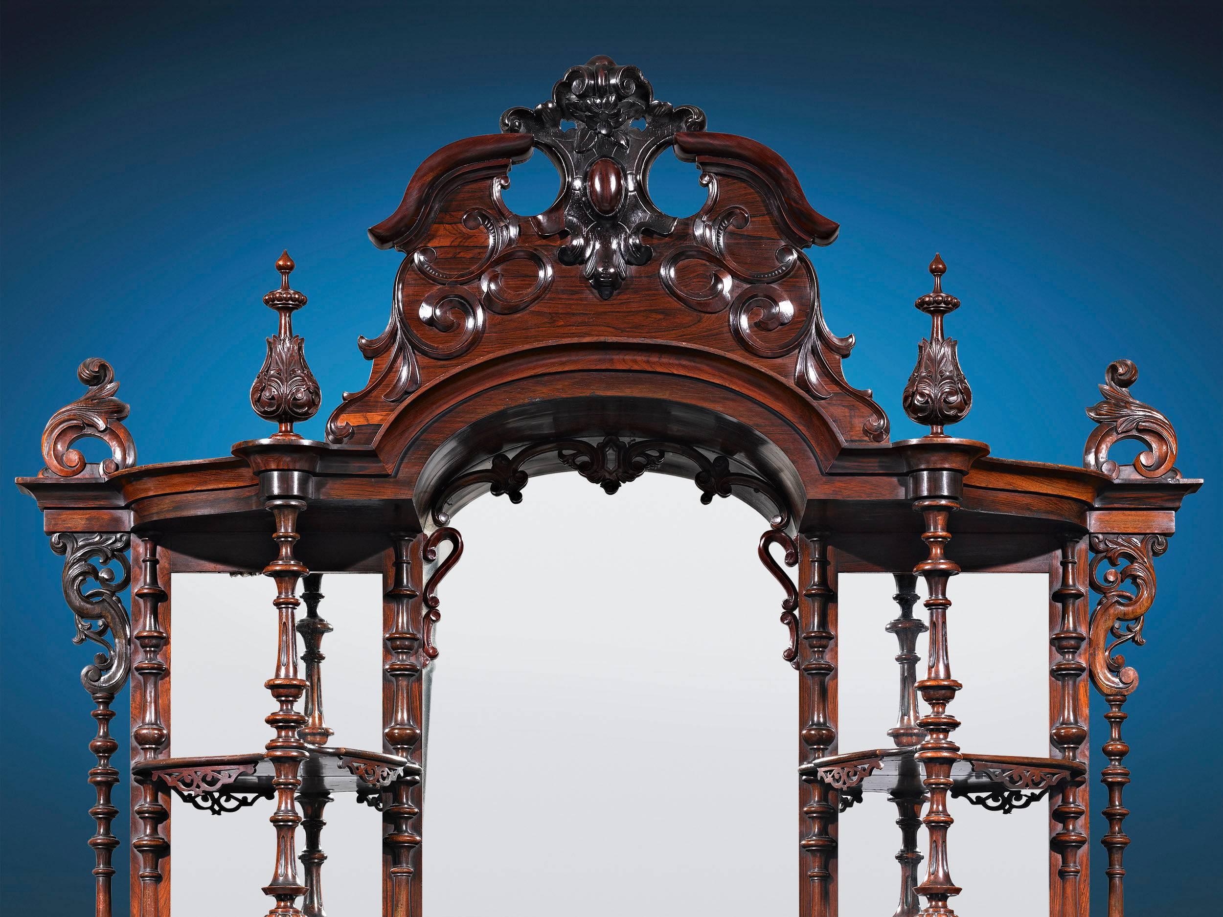 This monumental, museum-quality American Rococo Revival étagère was crafted by the renowned Brooklyn-based cabinetmaker Thomas Brooks. Beautifully designed and executed in rosewood, the extraordinary piece is set apart by its profusion of