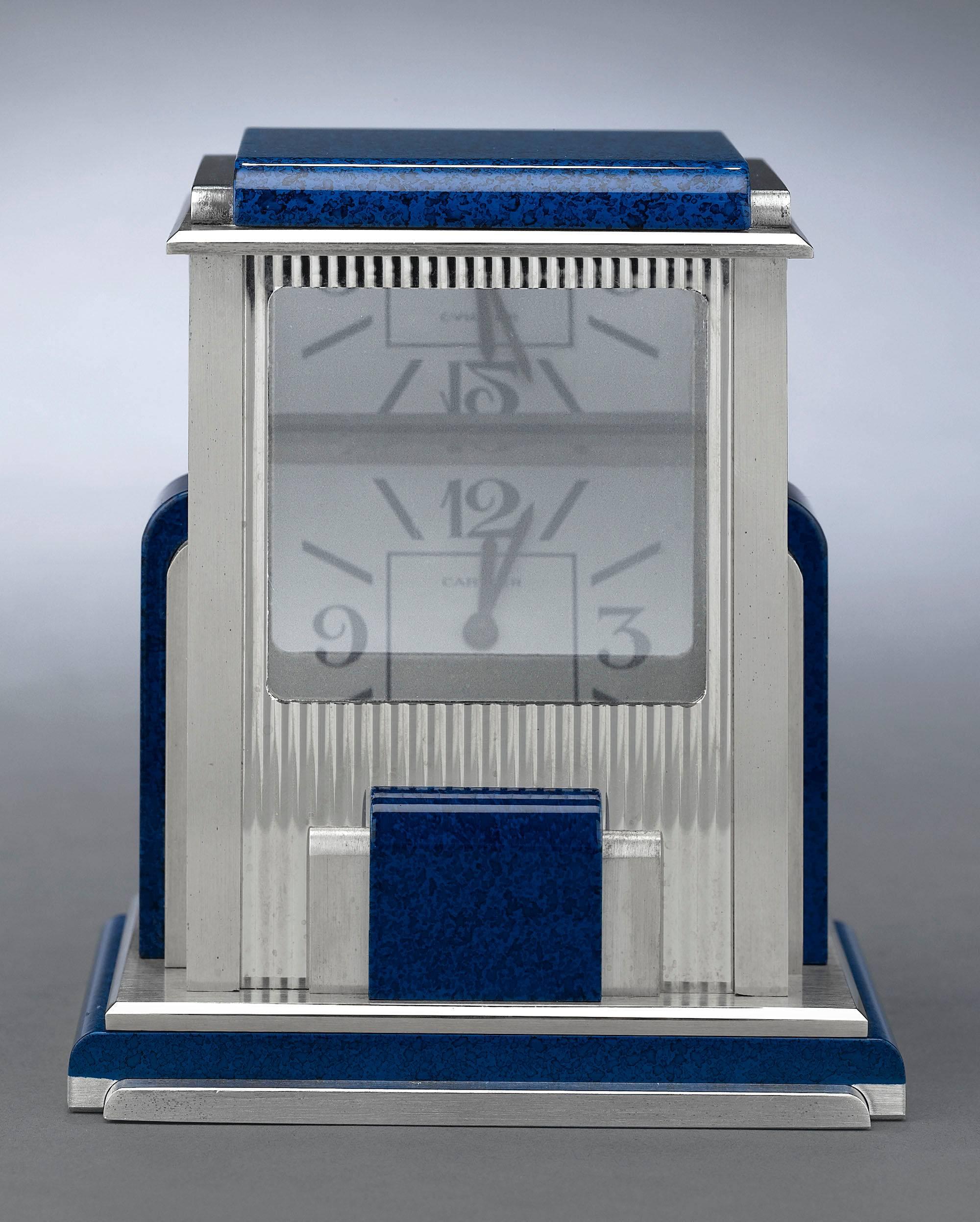 A work of exceptional engineering and stylish artistry, this mystery clock by Cartier is known as a “prism” clock. Crafted in a sleek Art Deco style with simulated lapis lazuli accents, this silver-plated desk clock is equipped with a set of quartz