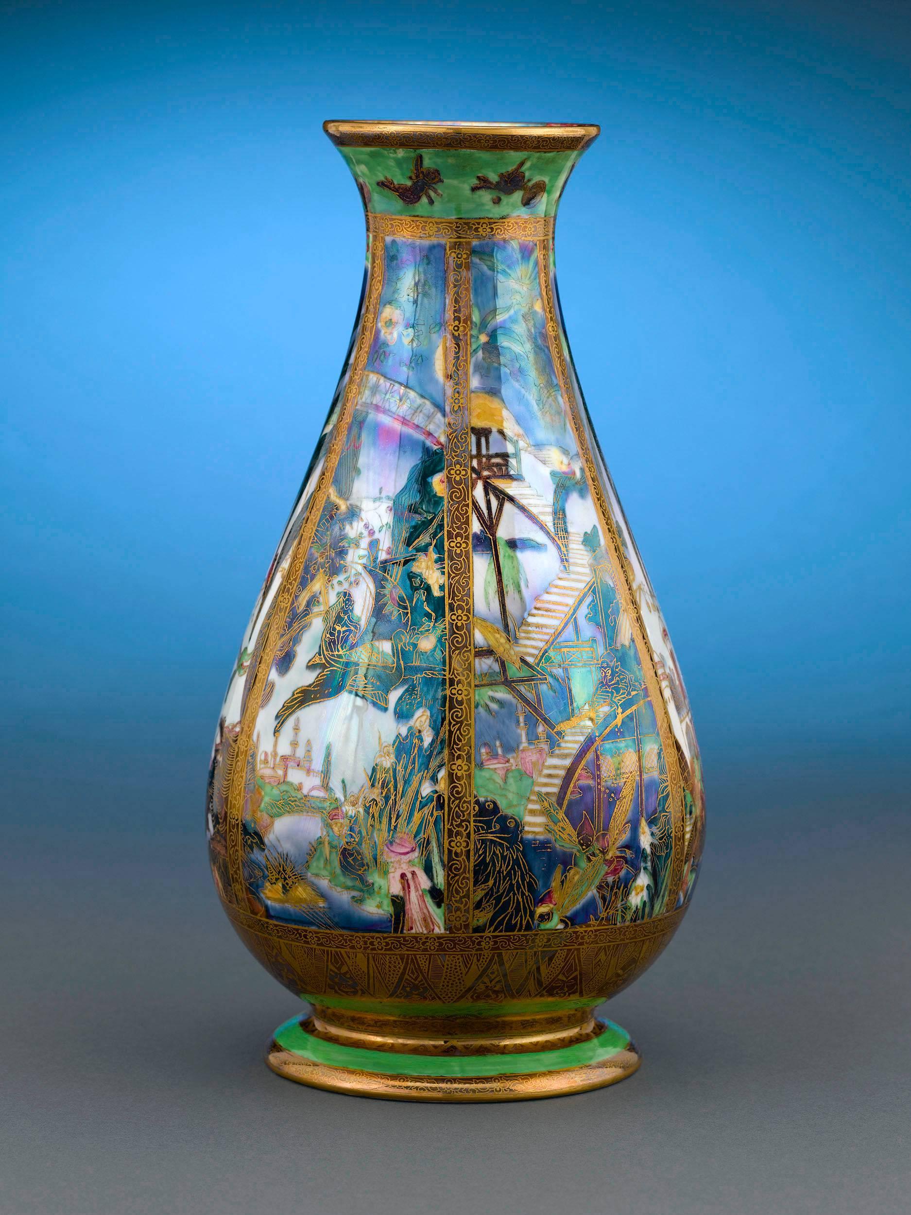 One of the earliest Fairyland Lustre motifs, this pillar pattern vase by Wedgwood features the fantastical Isle of the Genii, populated with nymphs and elves at every turn. Introduced by Wedgwood artist Daisy Makeig-Jones in 1915, Fairyland Lustre