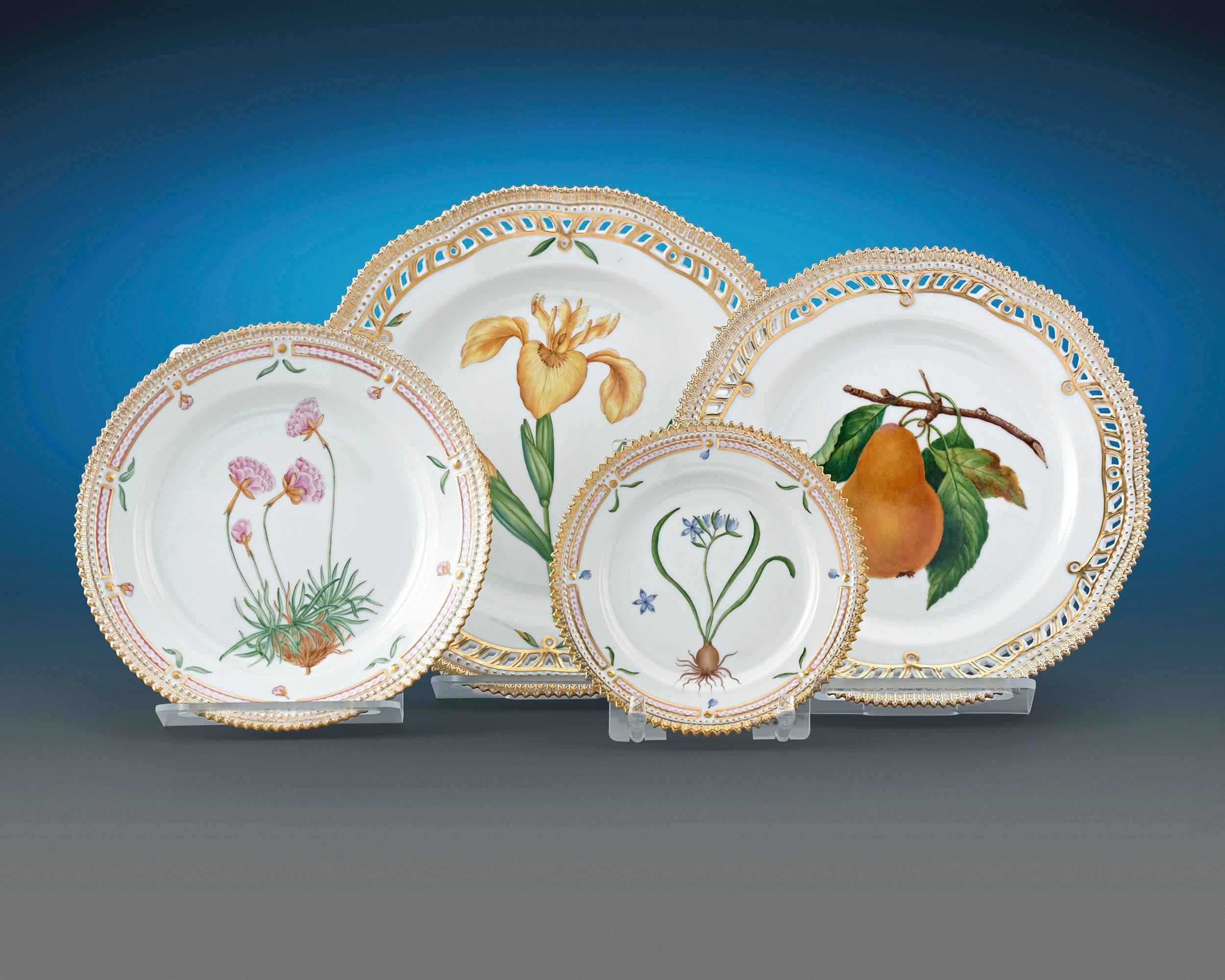 This remarkable 119-piece Flora Danica dinner service was crafted by the Royal Copenhagen Porcelain Manufactory. From the rich, hand-painted botanical motifs to the delicate rose accents, each piece in this set reflects the meticulous skill and
