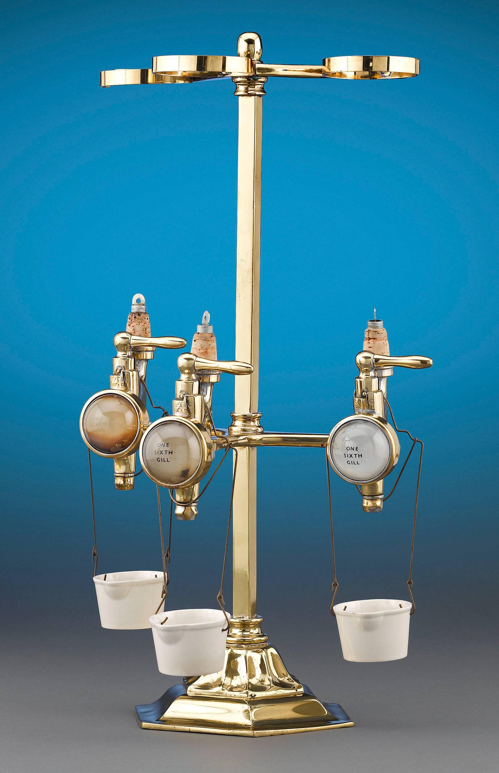 This set of three non-drip drink dispenser measures was a must have for any professional bar. Also known as optics due to their resemblance to optical lenses, these gravity-fed dispensers took any guesswork out of dispensing the correct amount of
