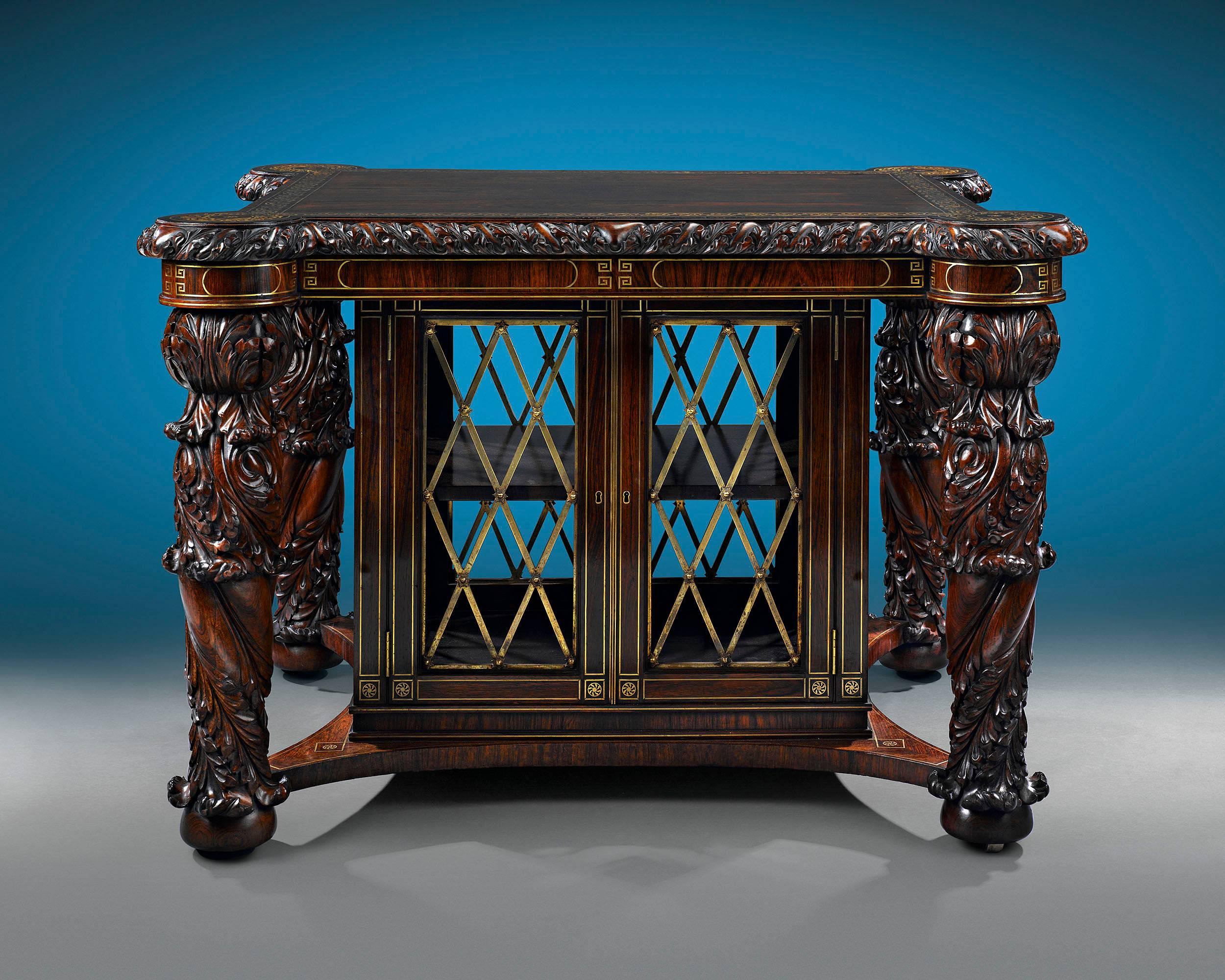 This rare and exquisite English library folio cabinet, almost certainly crafted by famed cabinetmaker George Bullock, is a tour-de-force of Regency-period design. Crafted of sumptuous rosewood, this impeccable table features beautifully carved