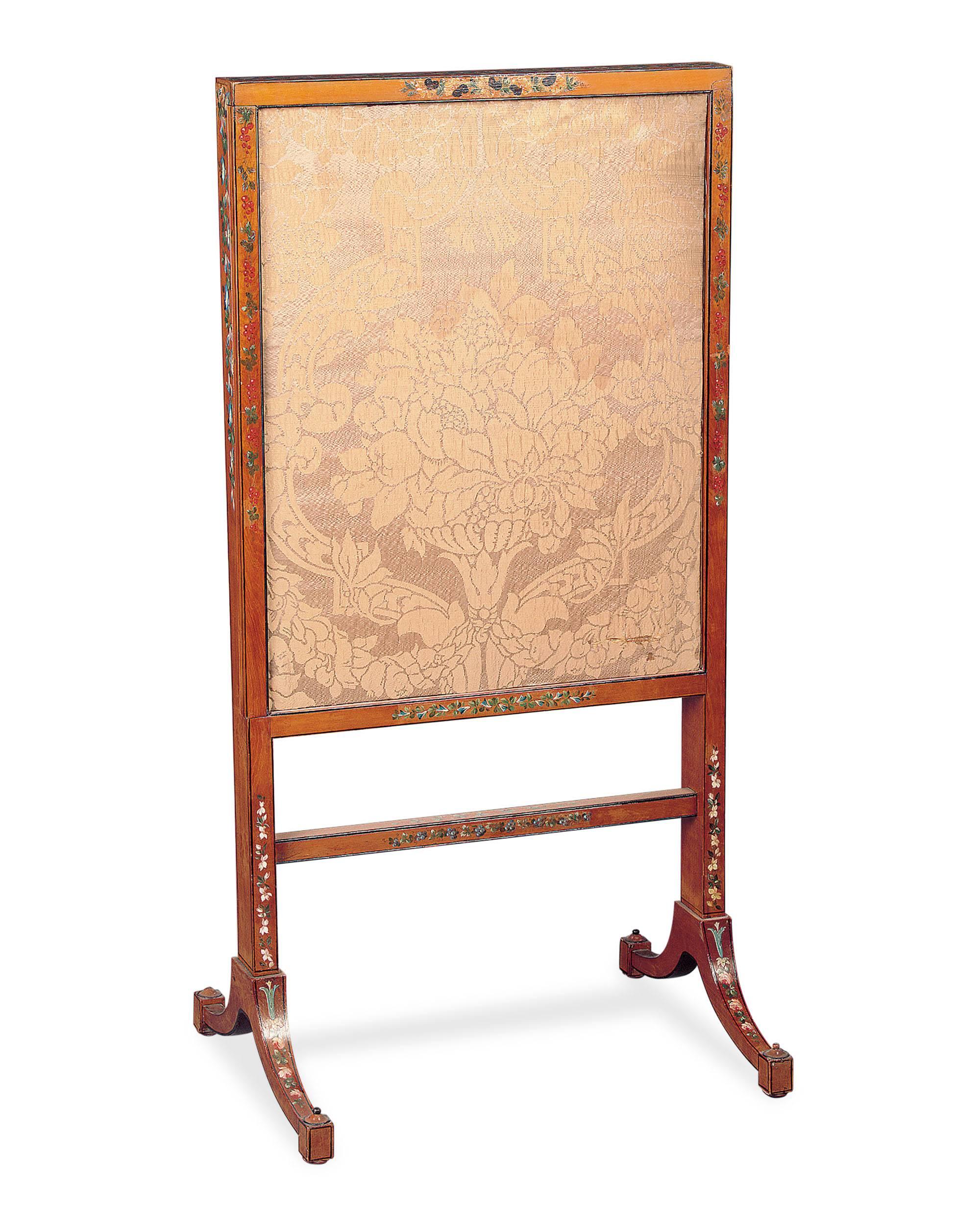 A fine English hand-painted satinwood fire screen in the Sheraton style with silk upholstered panels that extend from either side of the screen. The screen features exquisitely painted decoration and is in excellent condition.

circa