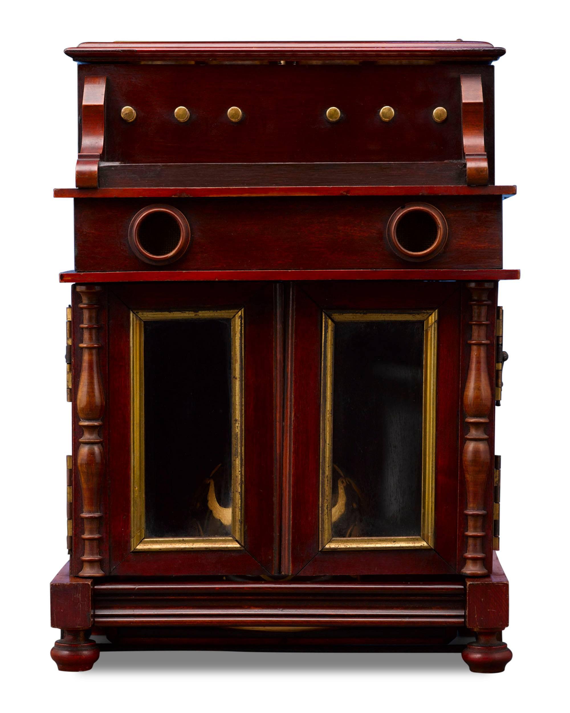 This rare and outstanding piano cave à liqueur provides both musical and liquid refreshment. Simply press the keyboard and one of two delightful airs from the hidden music box begins to play, causing the piano's glass panelled lid and doors to swing