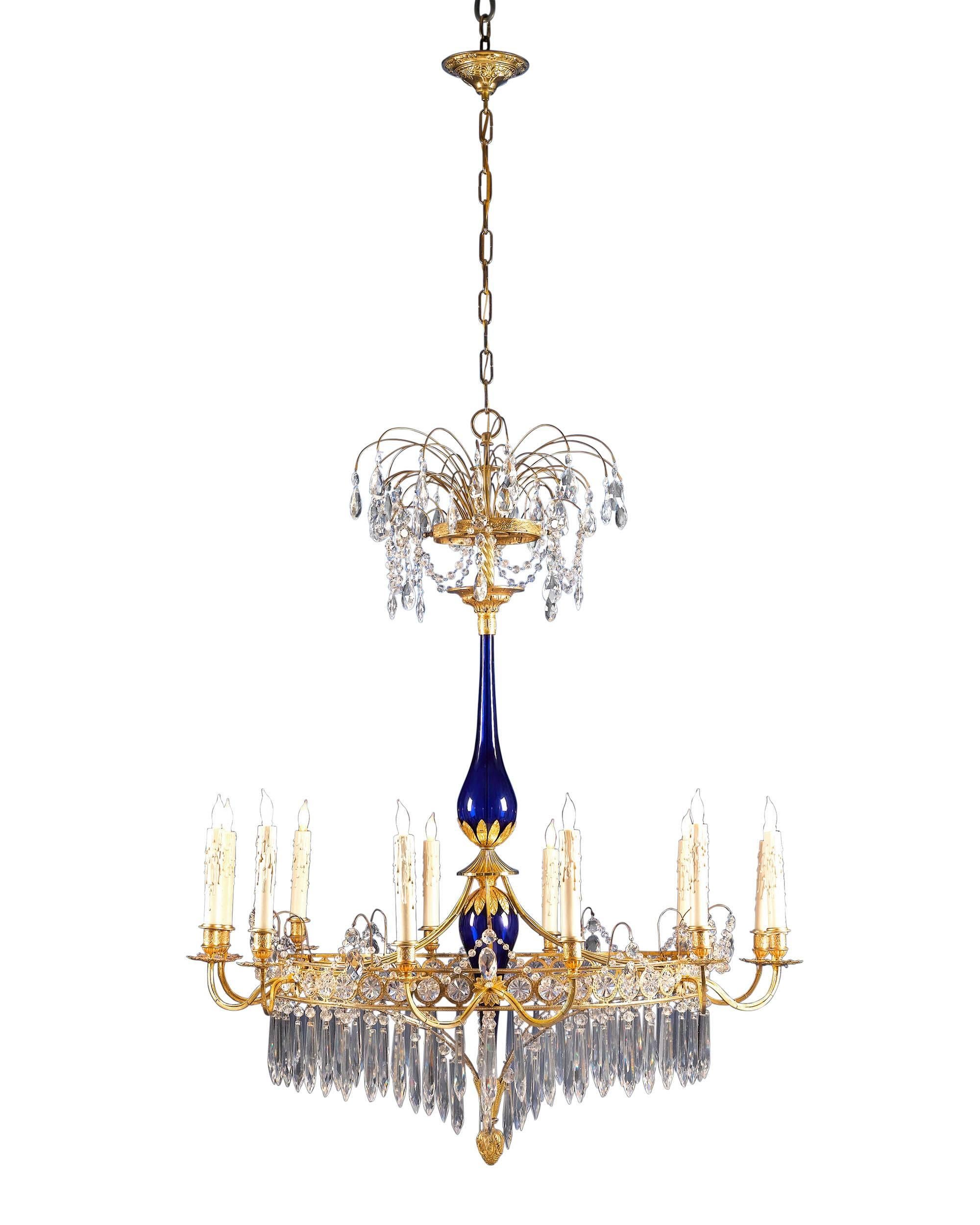 This exceptionally rare, Russian Neoclassical chandelier is the epitome of early 19th century luxury and style. Crafted in Saint Petersburg of mercury-gilded bronze, cobalt blue glass and intricately cut crystal in an exuberant fountain motif, this
