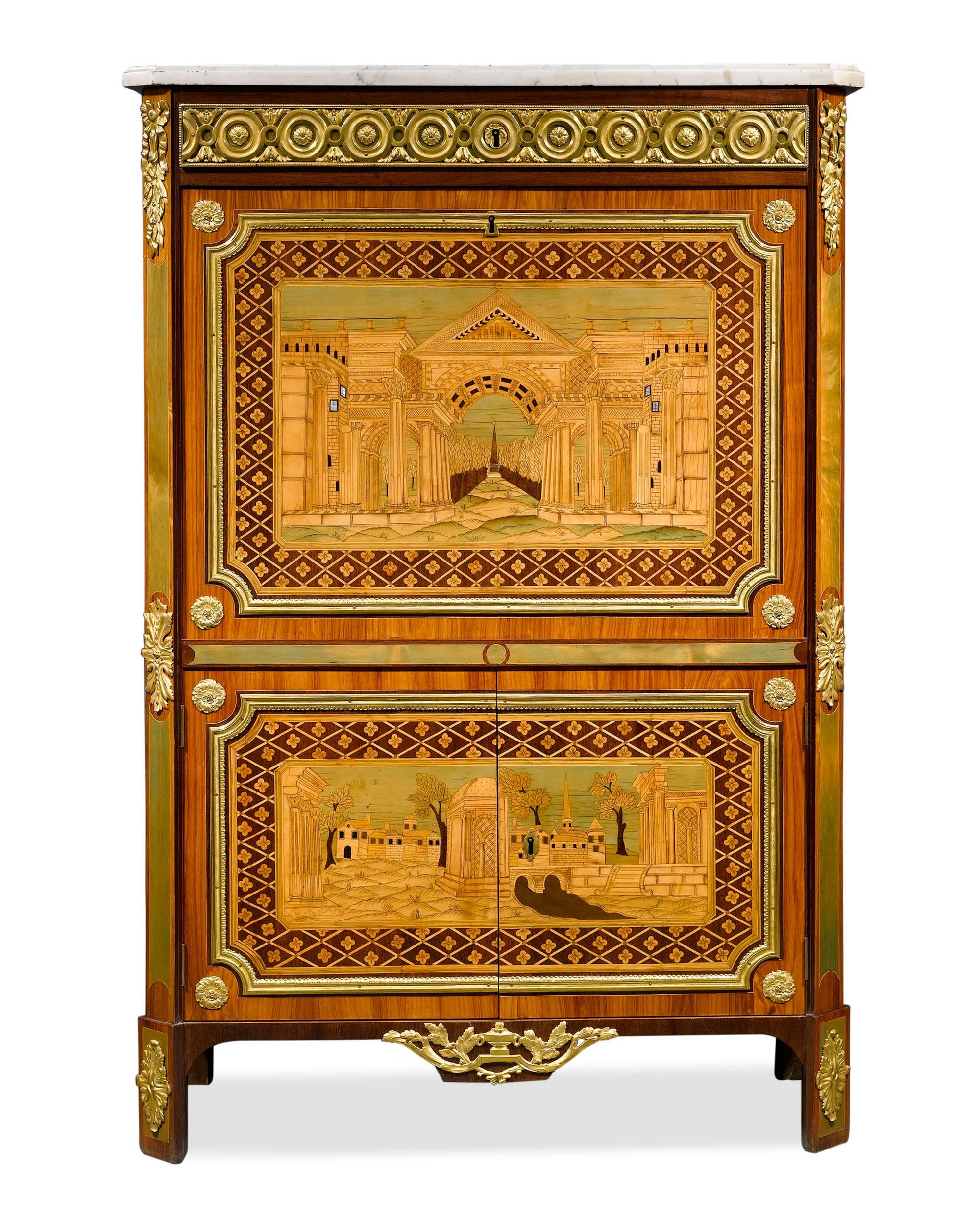 This remarkable secretaire à abattant by master ébéniste André Gilbert features colorful marquetry in rosewood, amaranth, stained holly, and mother-of-pearl. It is further embellished by a white marble top and doré bronze mounts of rosettes,