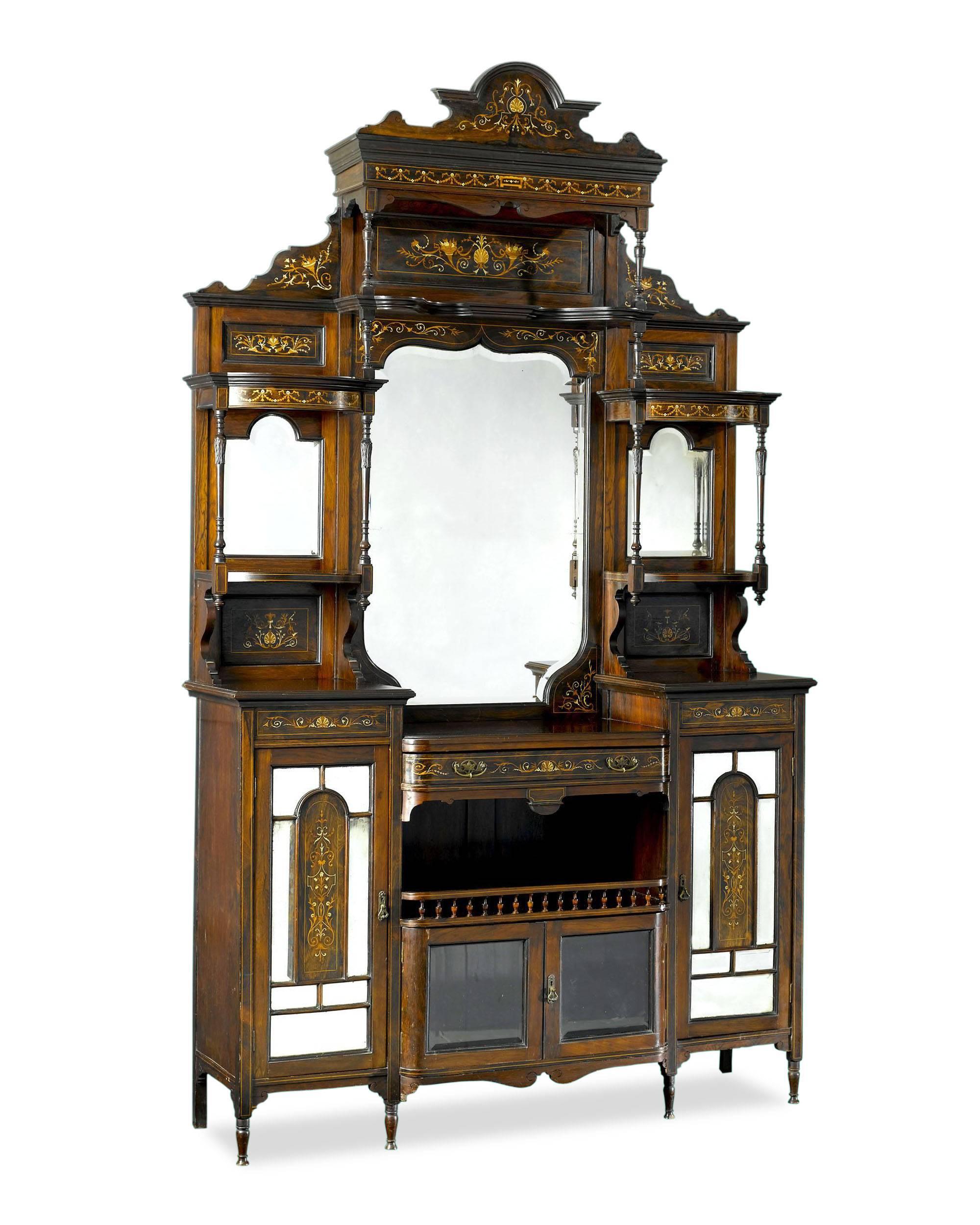 A lovely English rosewood etagere formerly part of the collection of a stately mansion in Hallowell, Maine. Delicate inlay and ornate design distinguish this fine antique. Impressive in size and quality, this piece was crafted with mirrored panels,