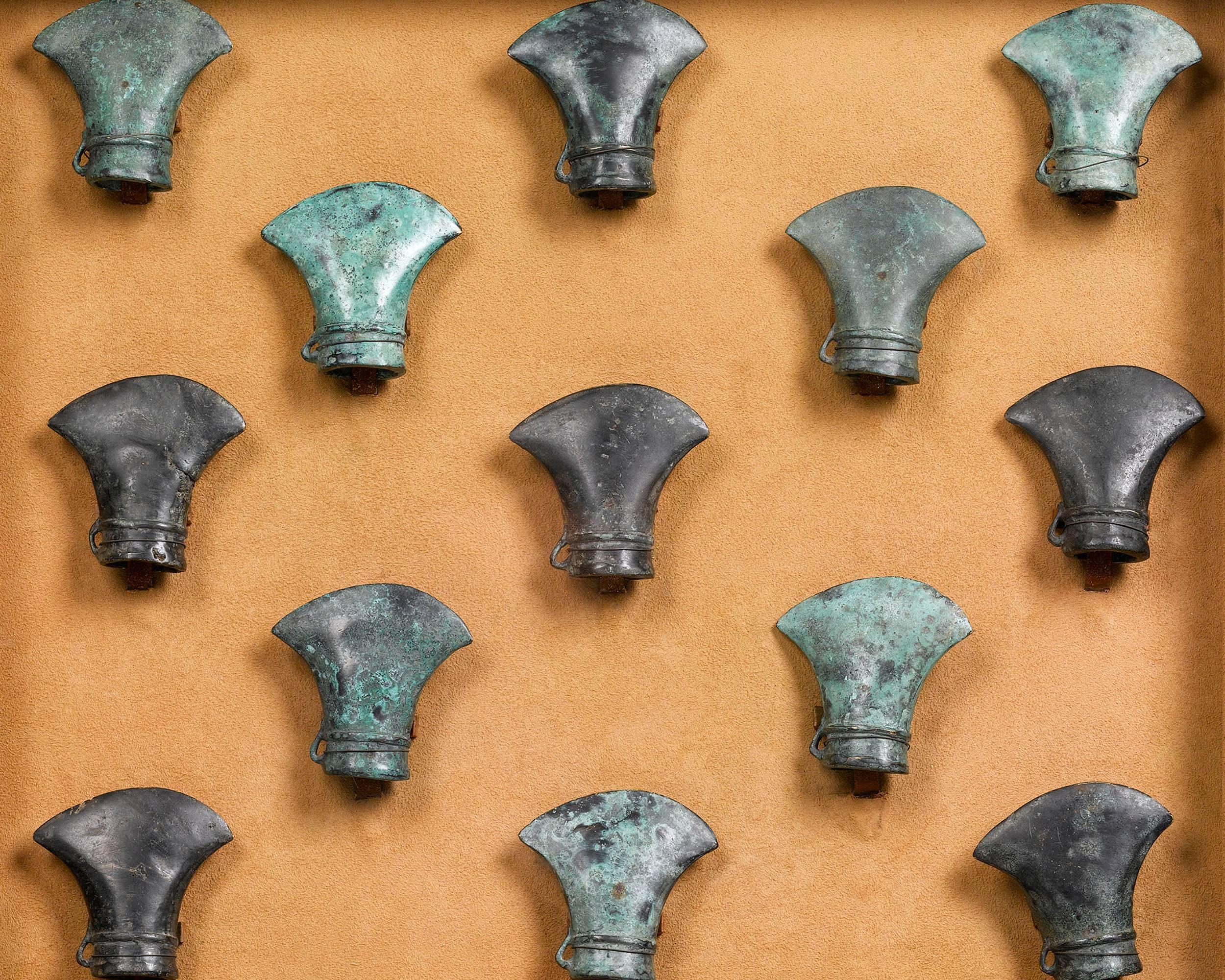 These rare, early Celtic bronze axe heads were forged in northern Gaul during the late Bronze and early Iron ages. Found in Longrave, Caen, France in 1929, these axes were crafted during a time in Europe when the use of copper and bronze tools