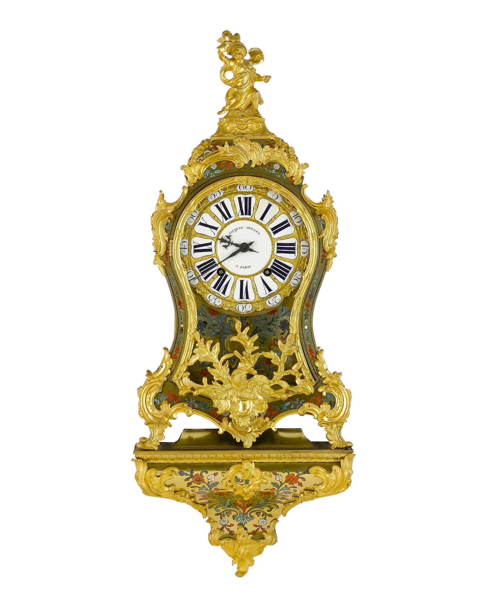 This outstanding Louis XV clock displays exquisite marquetry in the style of André-Charles Boulle and features a movement crafted by Jacques Huguet, one of the premier clockmakers of the 18th century. The clock and its distinctive matching shelf are
