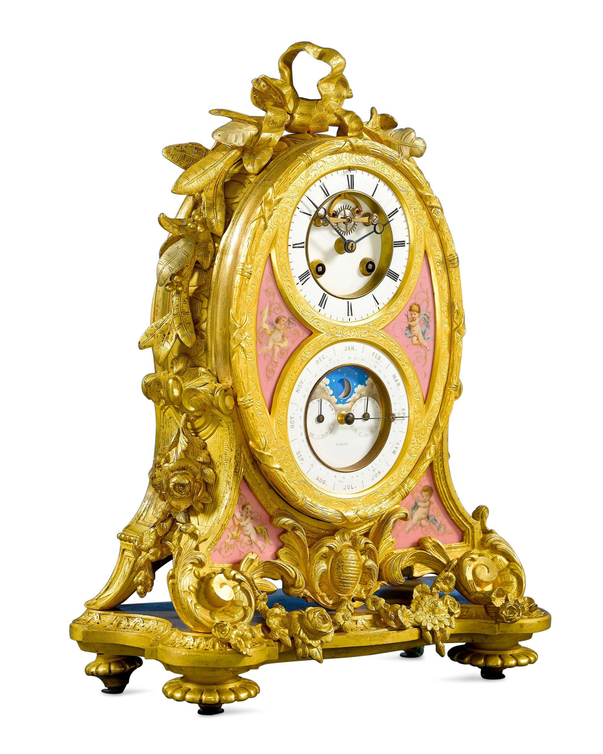 This beautiful perpetual calendar clock was created by the renowned Scottish jewelry firm of James Muirhead & Son. Crafted of fine ormolu and hand-painted porcelain, this elegant timepiece has a visible Brocot escapement in fine working