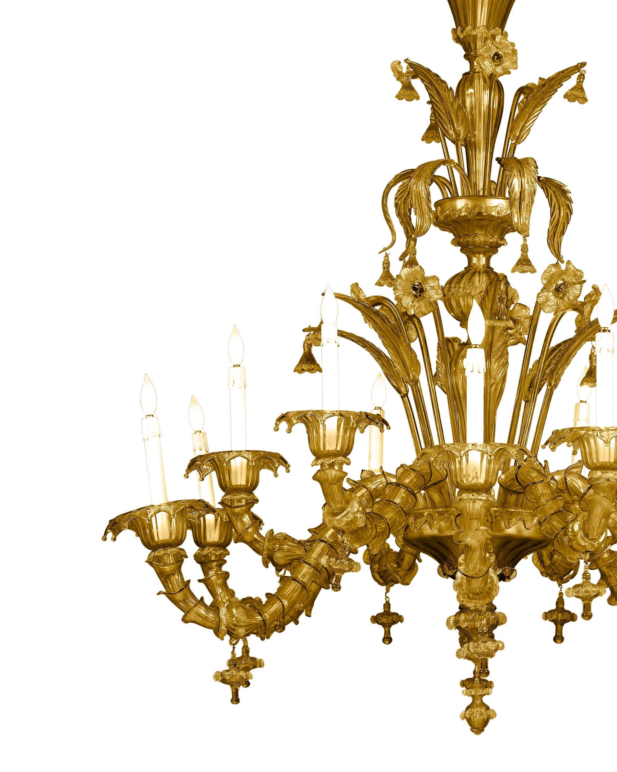 This majestic Murano glass chandelier is one of the finest examples of the exceptional Venetian glassmaking tradition. Composed of twelve lights sumptuously decorated with a garden of delicate flowers, flourishing leaves and a multitude of sculpted