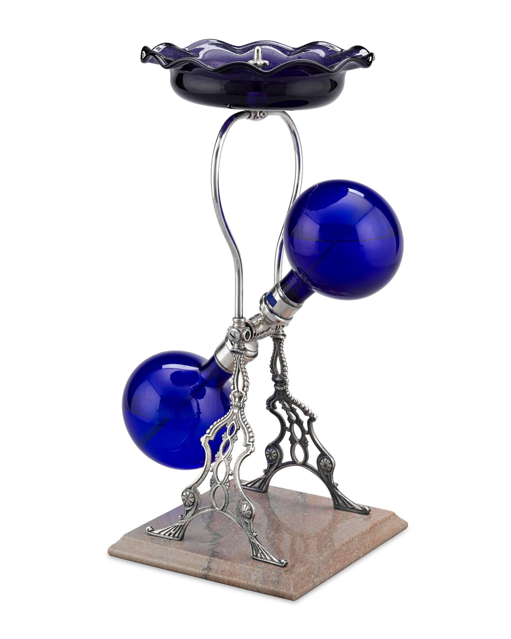 A fascinating and exquisite luxury of Victorian America, this incredible Automatic Cobalt Fountain was created by James Walker Tufts of Boston and was used to diffuse perfumed water to create an olfactory and visually-pleasing experience.

With no