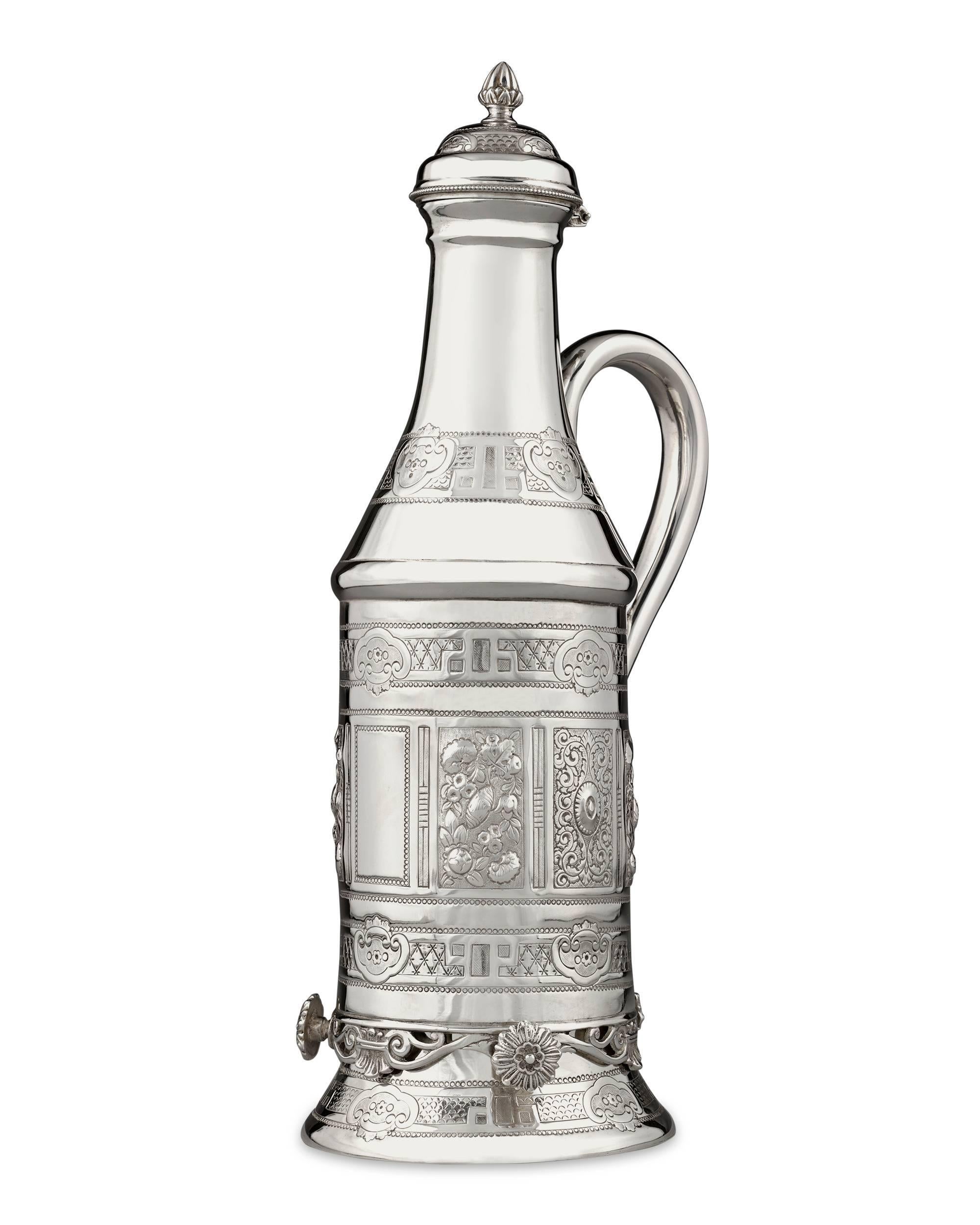 This Victorian silver plate wine holder is the perfect way to serve wine to your dinner guests in style. Crafted by Thomas Latham and Ernest Morton of Birmingham, the container is ingeniously designed to hold an entire bottle of your finest vintage.