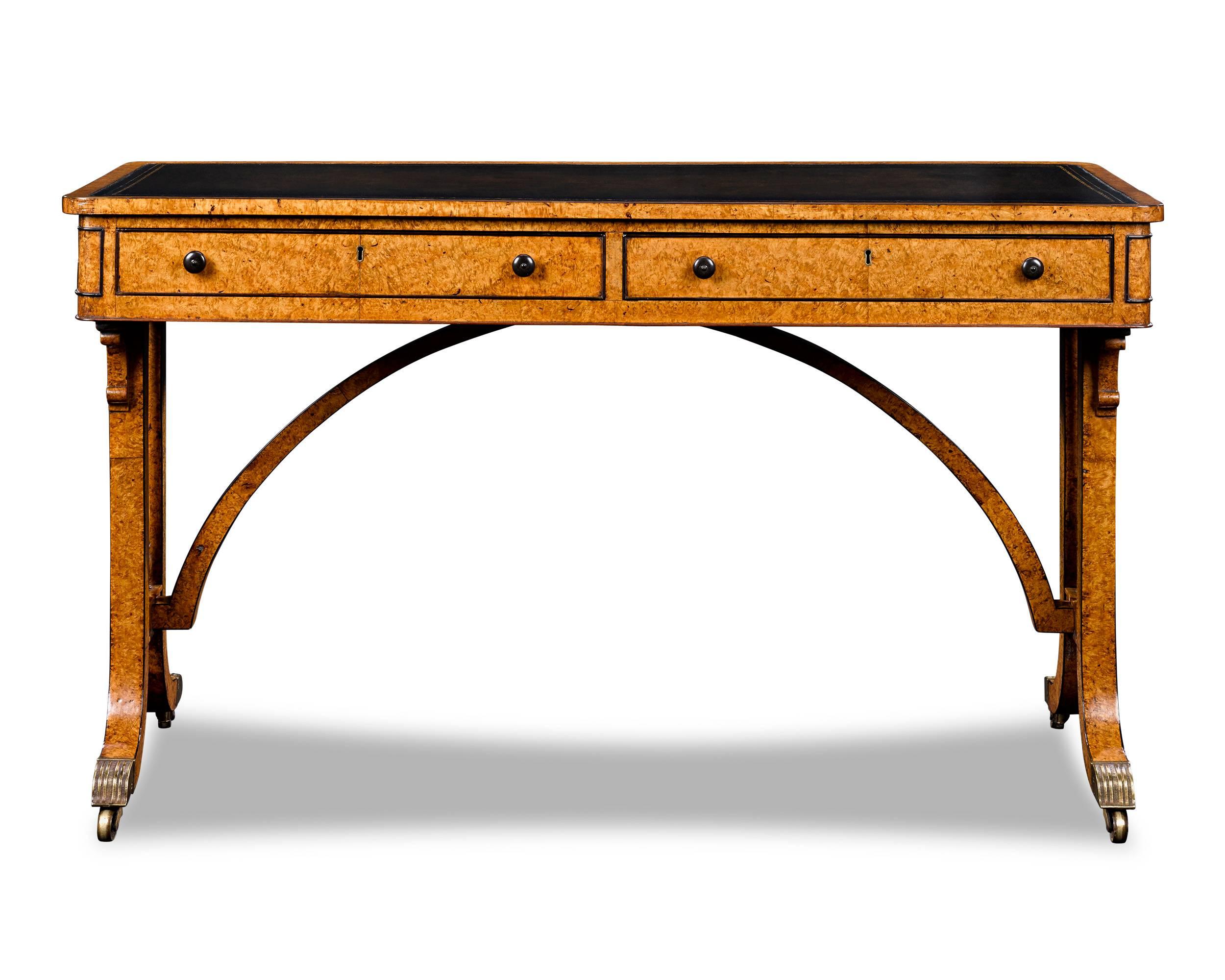 This outstanding English amboyna library table is an important example of the early Regency style design. The Regency era is considered by many to be the Zenith of English cabinet making, and this table is certainly exemplary of early 19th-century