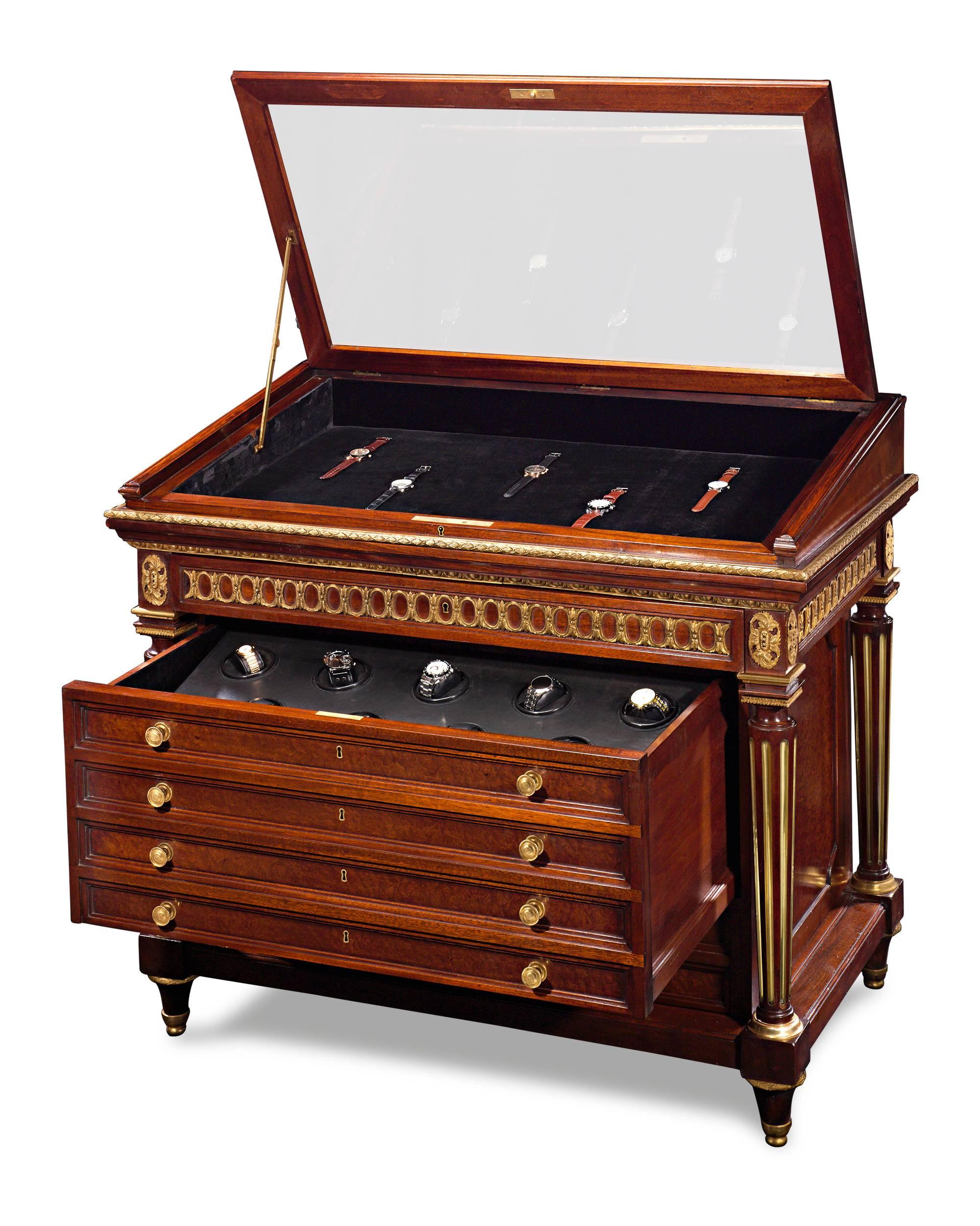 This incredible, one-of-a-kind watch display cabinet brings together the beauty of an antique with the functionality of modern technology. Crafted of mahogany, this 19th century jewelry display cabinet has been ingeniously retrofitted with an
