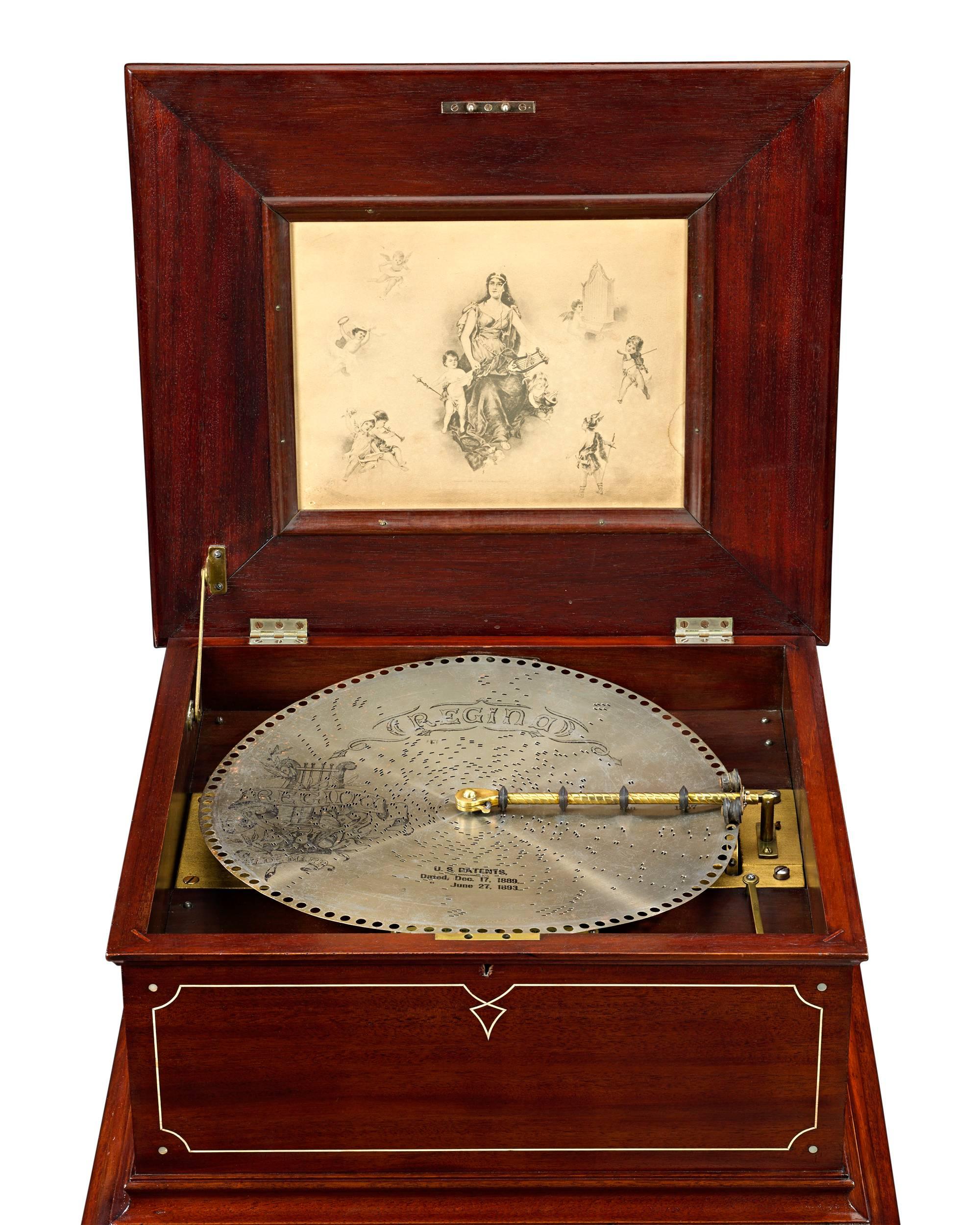 This outstanding disc music box was created by the Regina Music Box Company of New York. The box, known as Style 11, plays 15 1/2” disks on a single comb and retains the incredible sound quality for which Regina was celebrated. The mechanism is