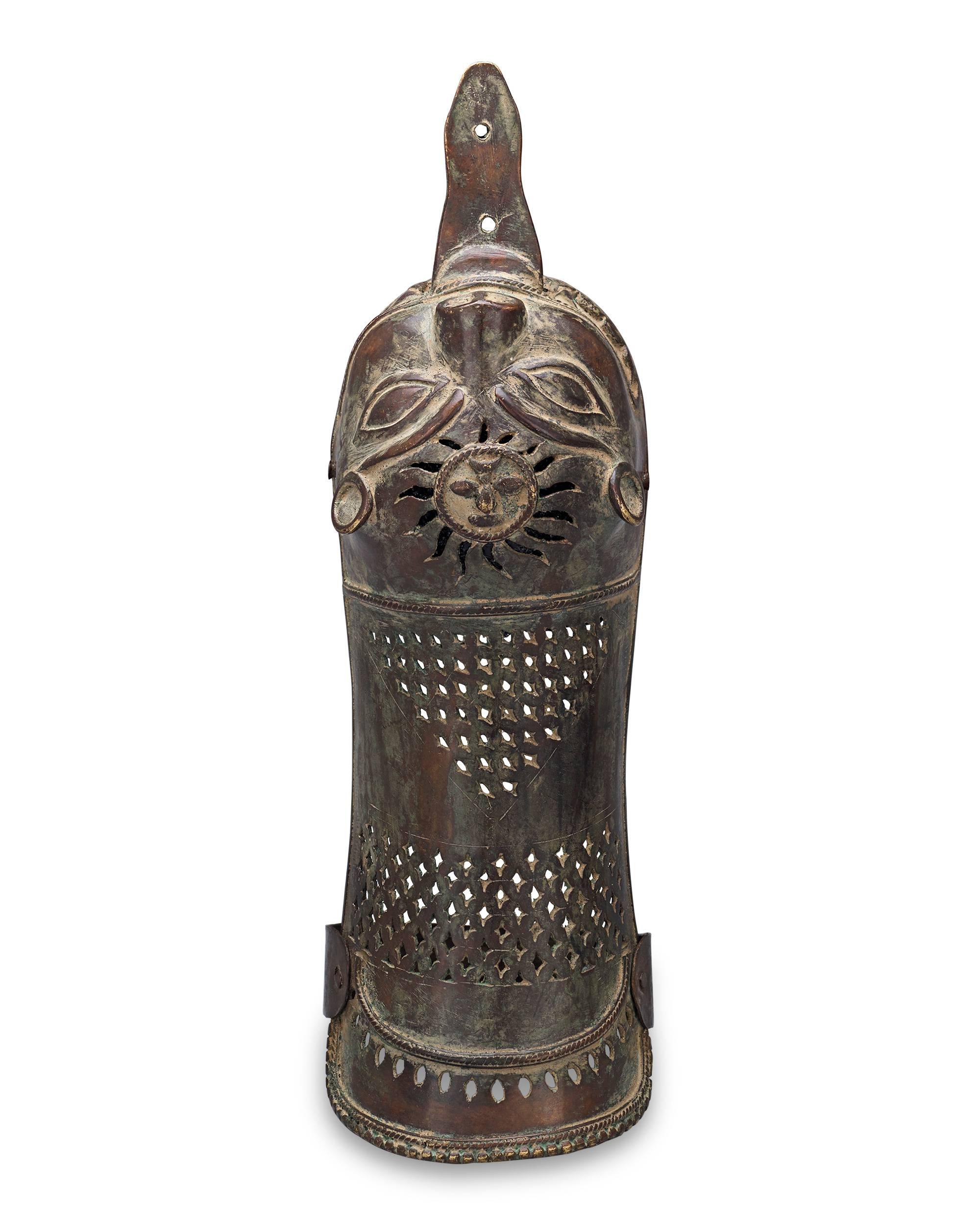 Taking the form of a fierce tiger is this fascinating early 19th century Indian pata gauntlet crafted of bronze. Originating during the Mughal period and used by Maratha warriors, the pata served as a handguard for a sword. Known as a