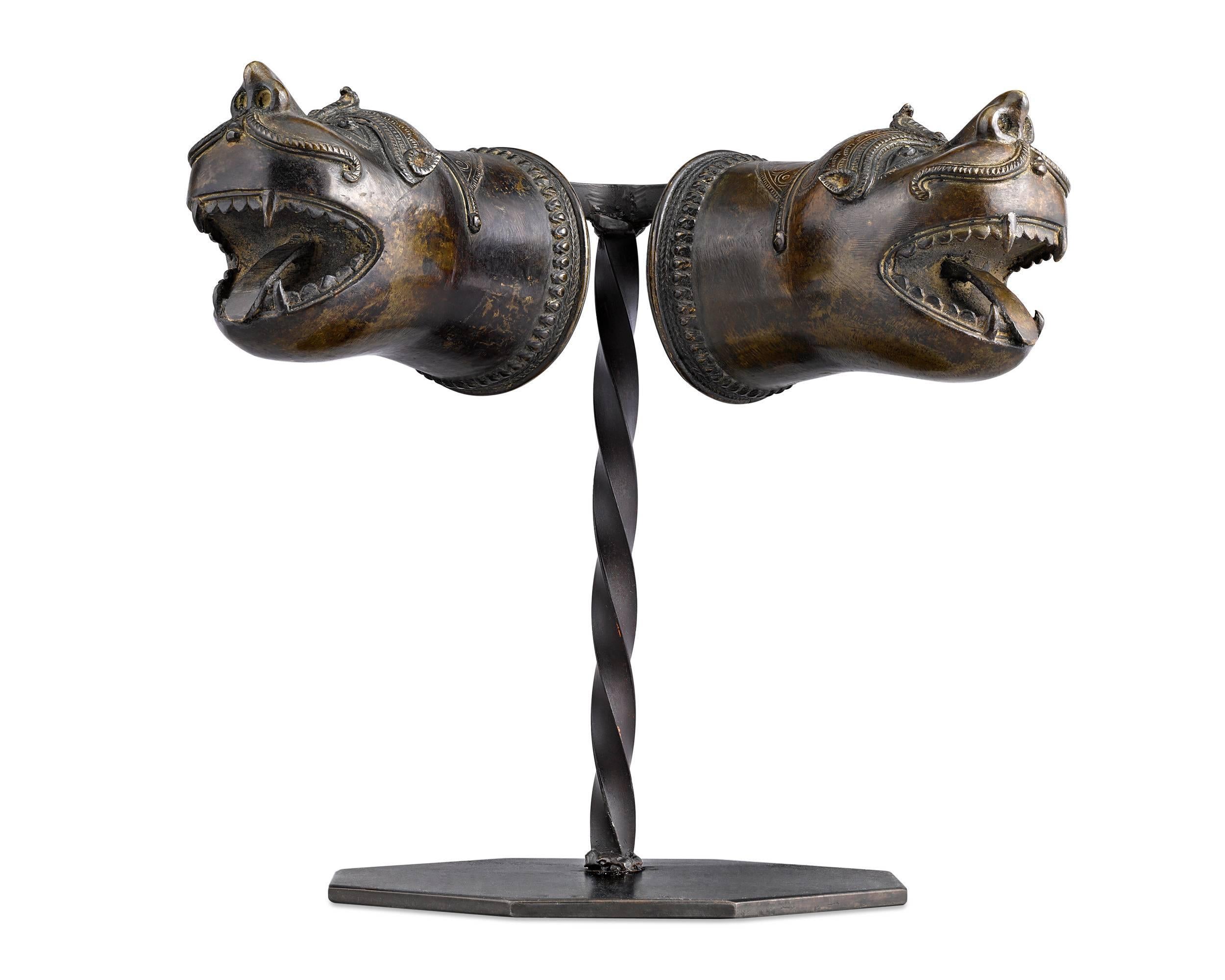 Beautifully stylized and crafted in the form of fierce leopards are these exceptional 18th century Indian bronze palanquin finials. Palanquin, or “palki”, are litter-type conveyances that have been in use in India for centuries. These finials would