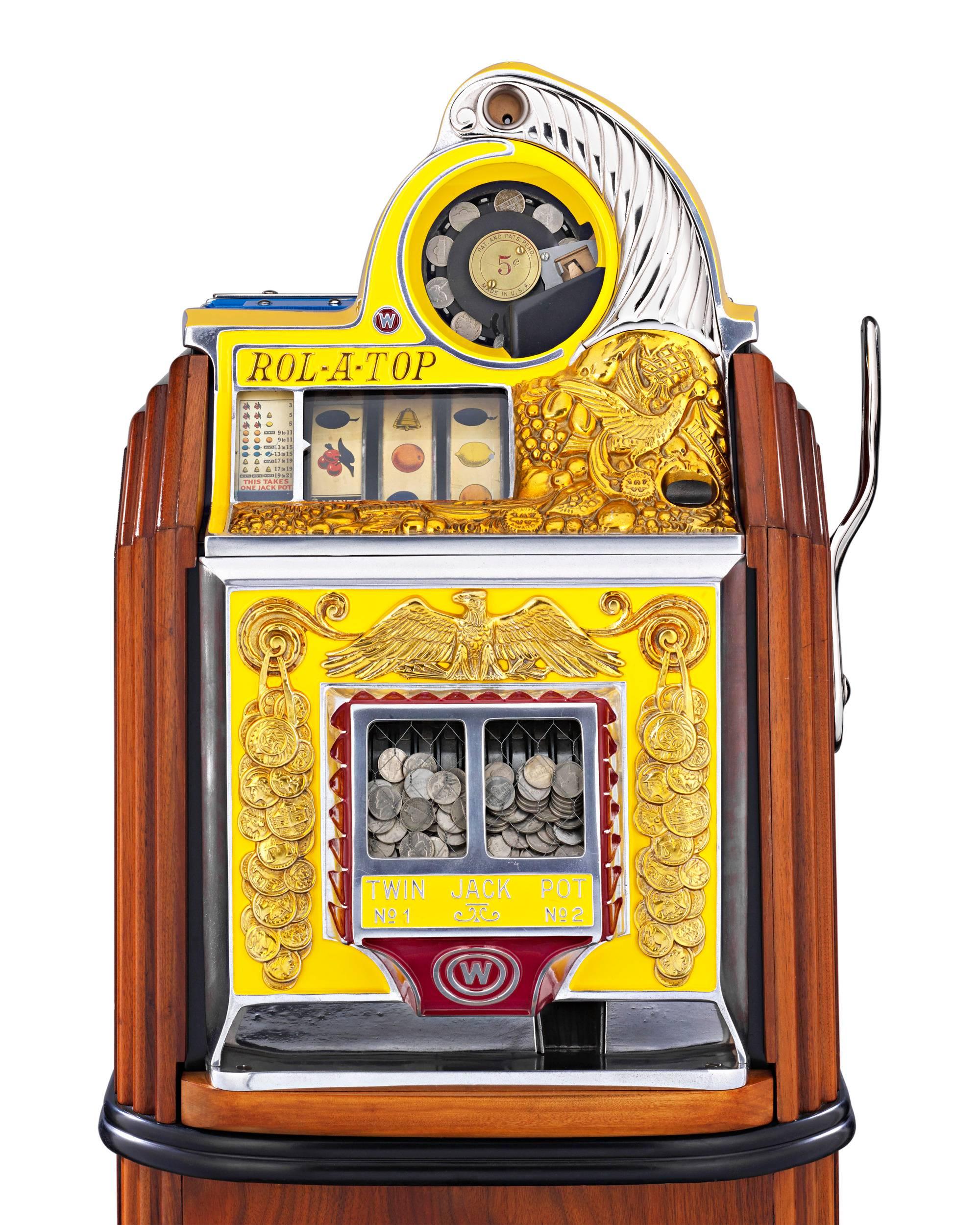 Extremely rare and highly desirable is this incredible Bird of Paradise console model of the famed Rol-A-Top slot machine. Introduced by Watling Manufacturing Company of Chicago in 1935, the Rol-A-Top was one of the most glamorous machines of the