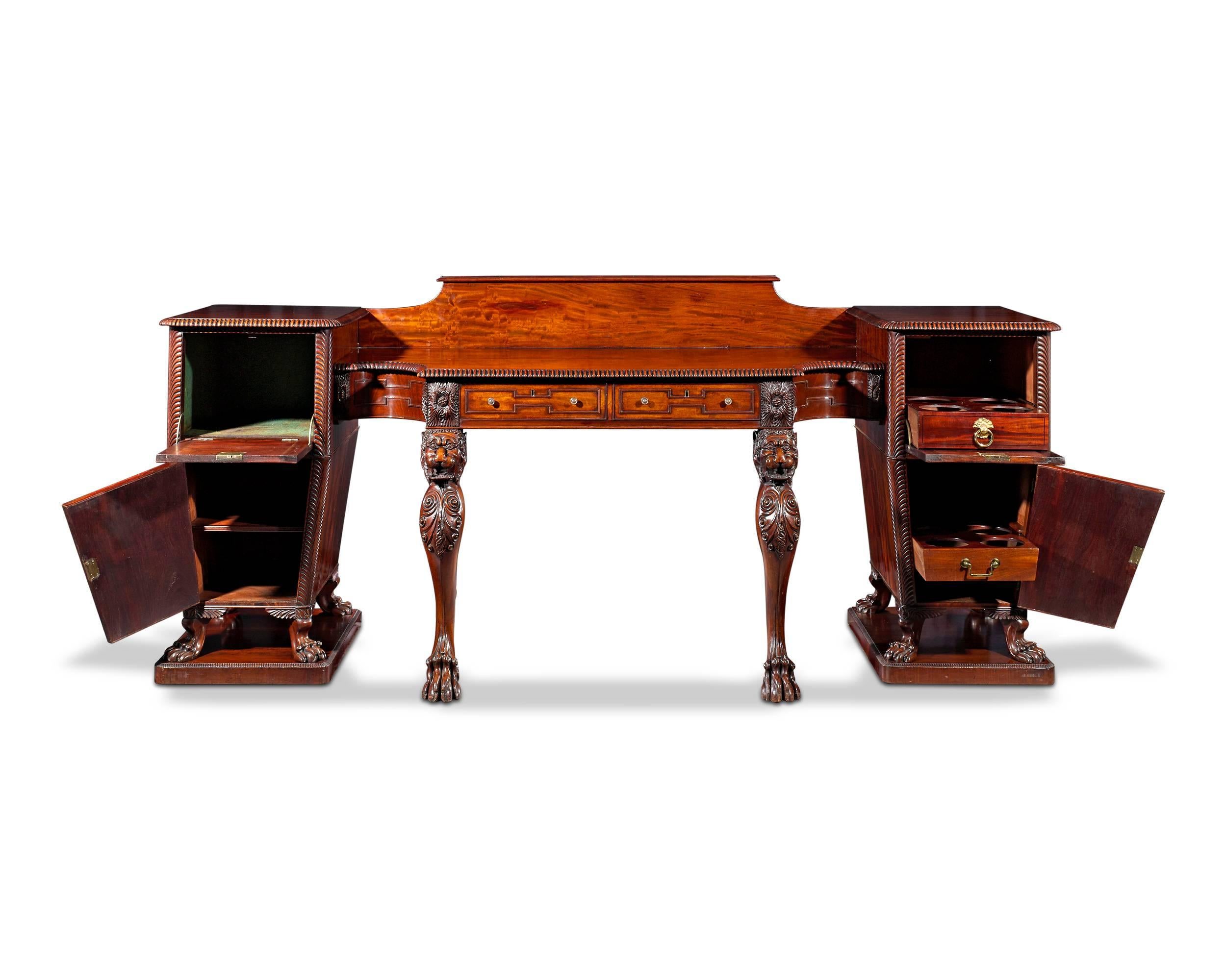 Wonderfully proportioned with a distinctive and skillfully executed lion motif is this incredible, early 19th century mahogany pedestal sideboard. This rare and resplendent specimen of Regency-era cabinetmaking would have been utilized in the dining