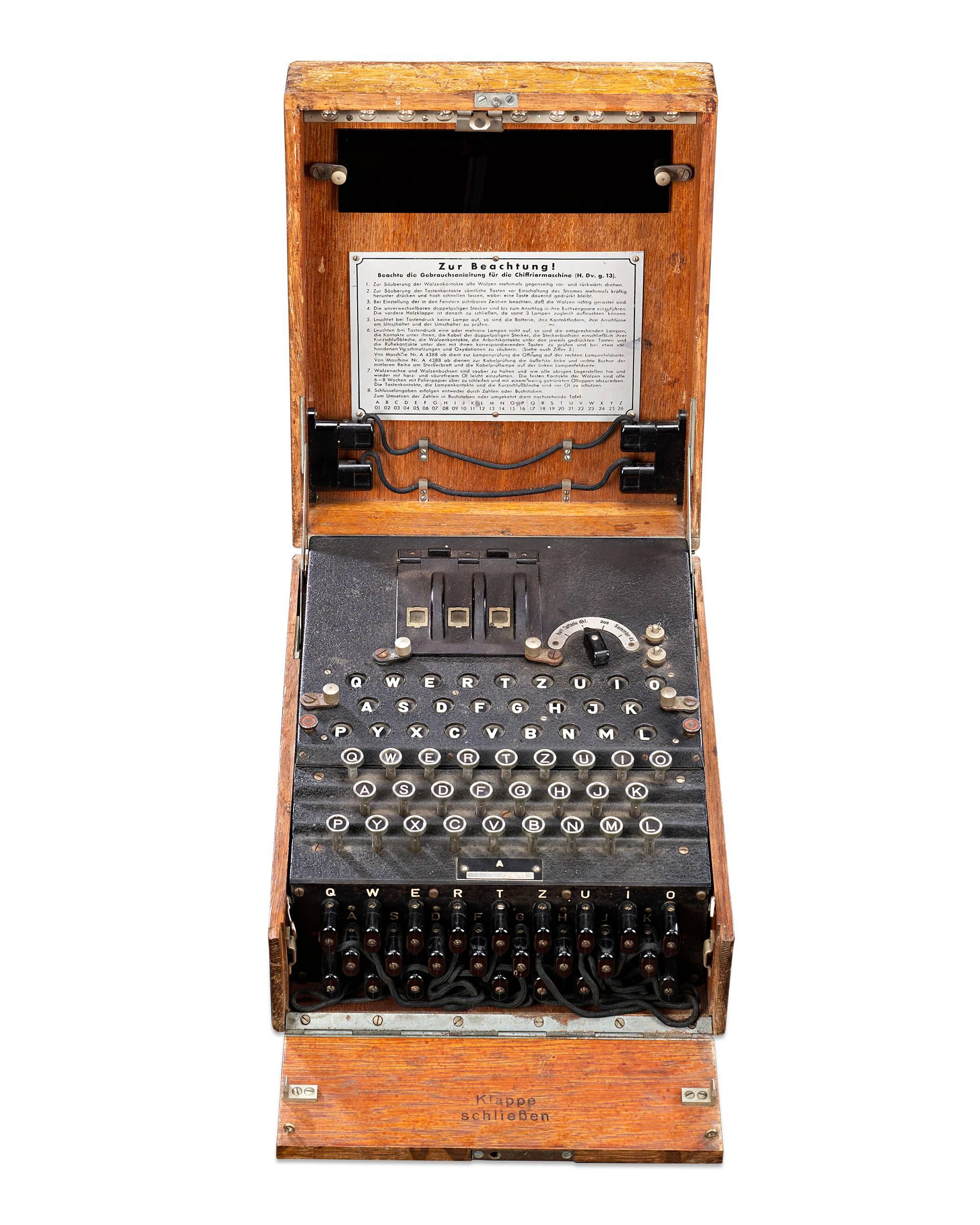 This highly important three-rotor Enigma I machine was used by the German Army during World War II. This machine, manufactured in Berlin, features three moving code rotors, or 