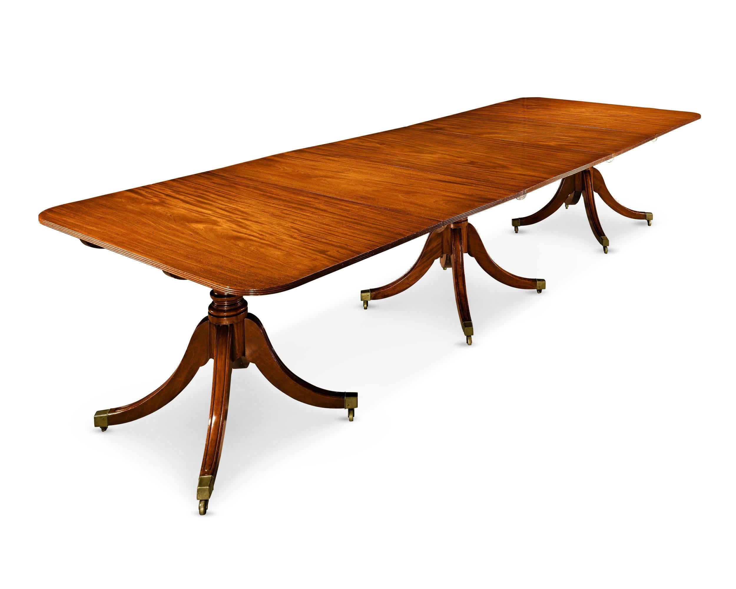 An extraordinary period Georgian mahogany dining table in complete and beautiful condition. Over time, the leaves and pedestals of these exquisite tables were often replaced, broken into smaller arrangements of reassembles with different veneers.