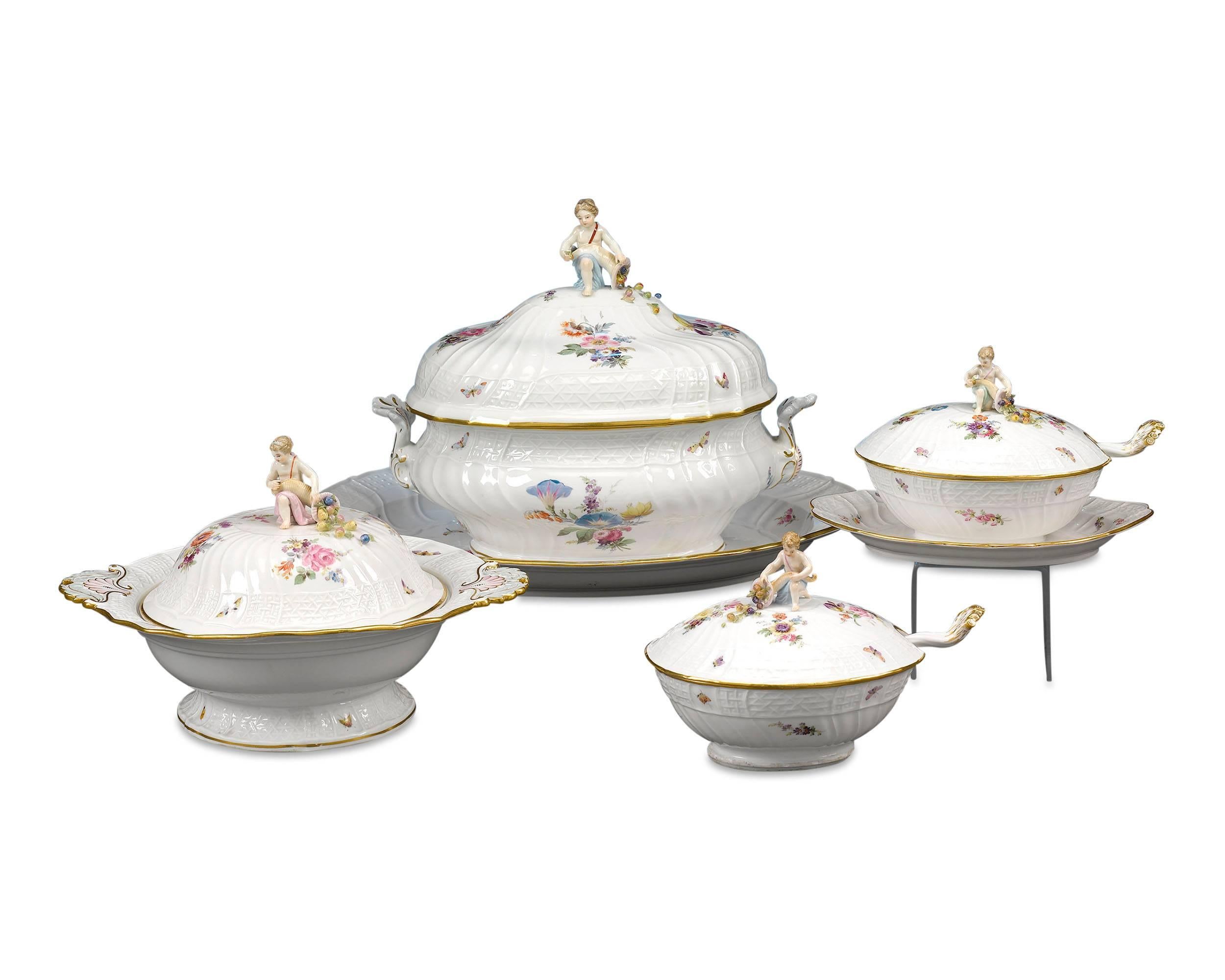 This resplendent 92-piece Meissen Porcelain dinner service for twelve is an exceptional example of the firm's domestic ware. The bodies are crafted in the New Brandenstein relief pattern designed by Johann Friedrich Eberlein in 1744, which gives