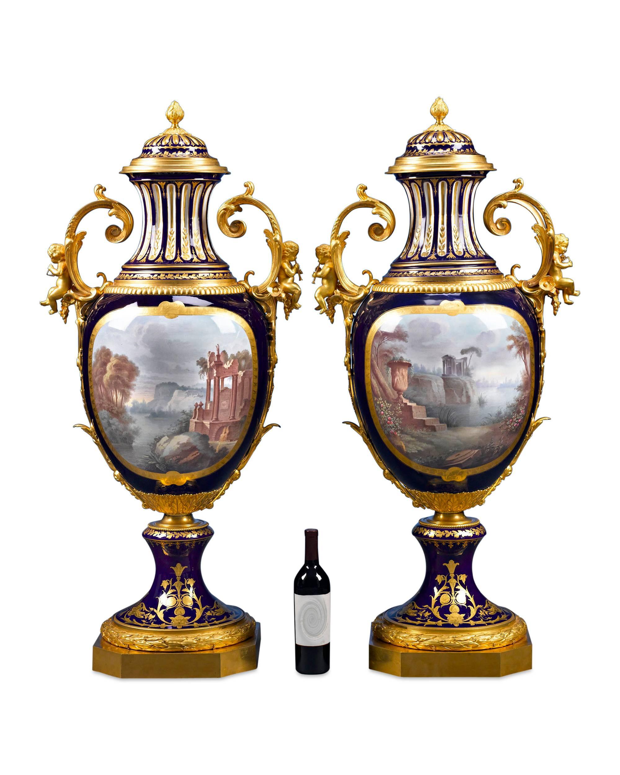 These bronze-mounted Sèvres porcelain urns are monumental in both size and quality and feature the renowned manufactory’s signature deep cobalt blue glaze. Sèvres urns were made in various sizes and qualities over the years, with the finest examples
