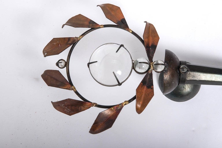 A pair of Olympia wall appliques by Mark Brazier-Jones.
Of forged iron, copper sheet, optical lens, glass balls,
England, circa 1990.
Measures: 75 cm high x 28cm wide x 15 cm deep.
Literature: C.Fiell “Mark Brazier-Jones, London 2012,