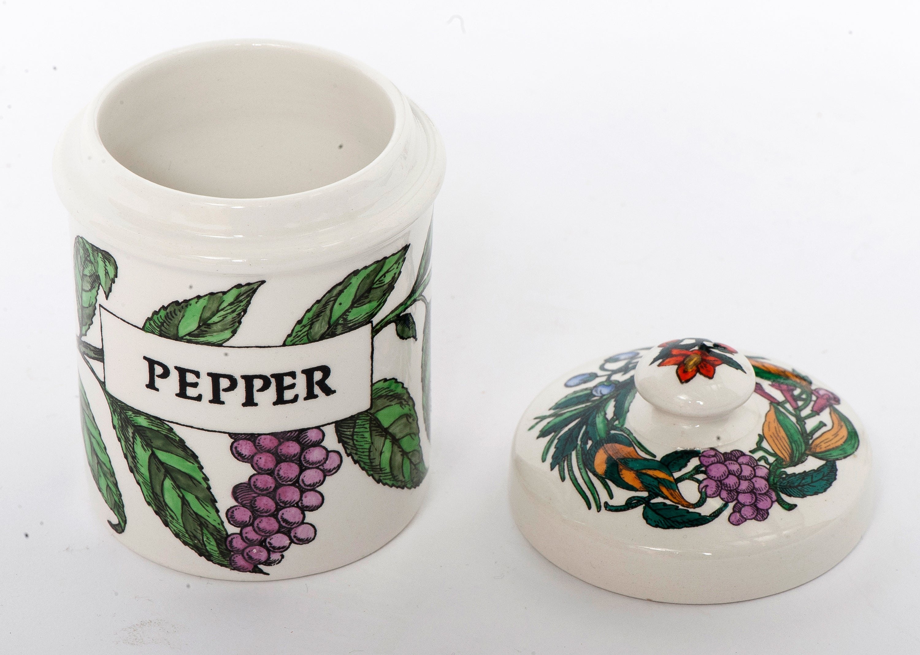 An early Fornasetti porcelain pepper jar with cover.
Lithographically printed and hand-painted,
Italy, circa 1960.
Marks to base.
Dimensions: 12cm high x 6cm diameter.