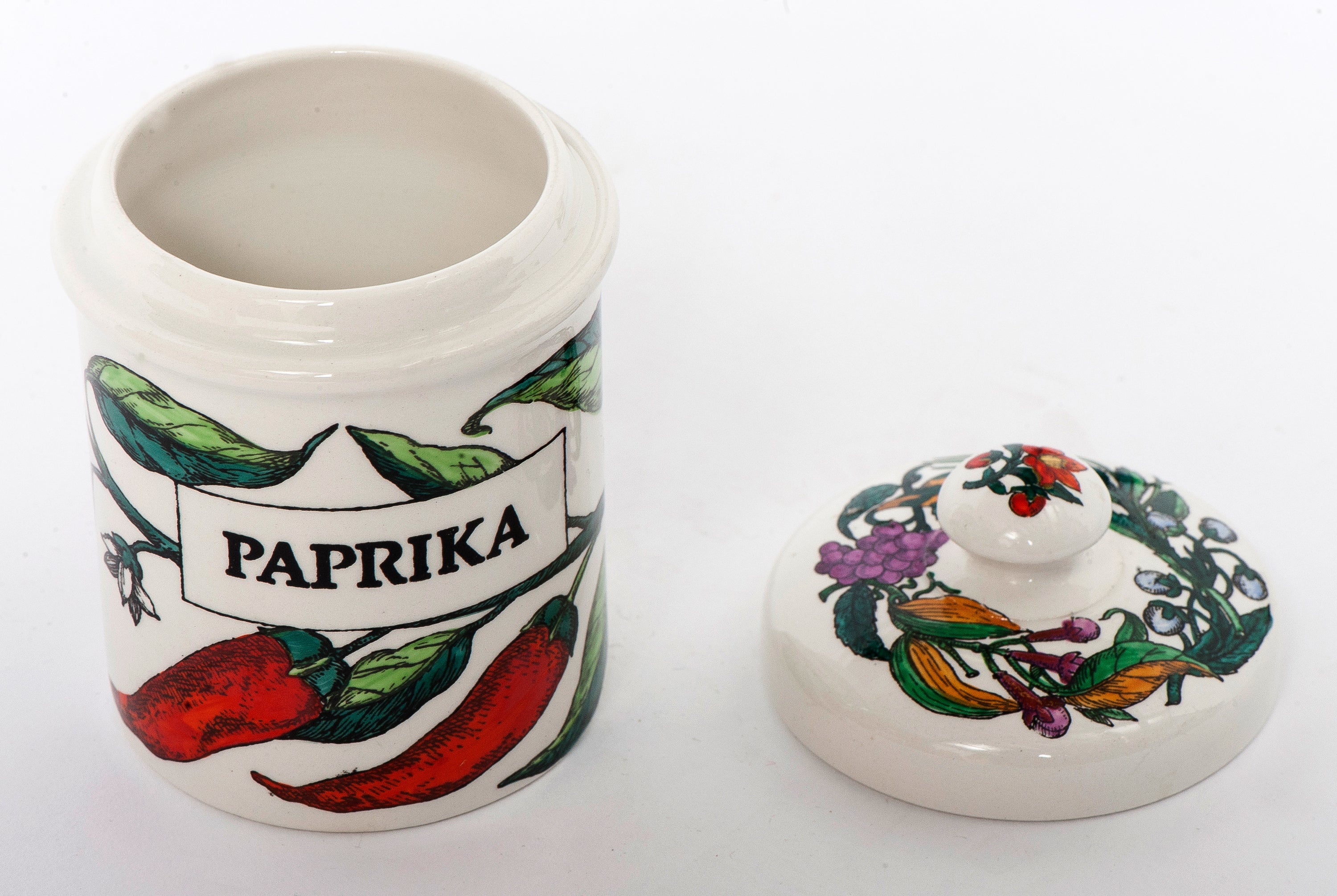An early Fornasetti porcelain paprika jar with cover.
Lithographically printed and hand-painted,
Italy, circa 1960.
Marks to base.
Measures: 12cms high x 6 cm diameter.