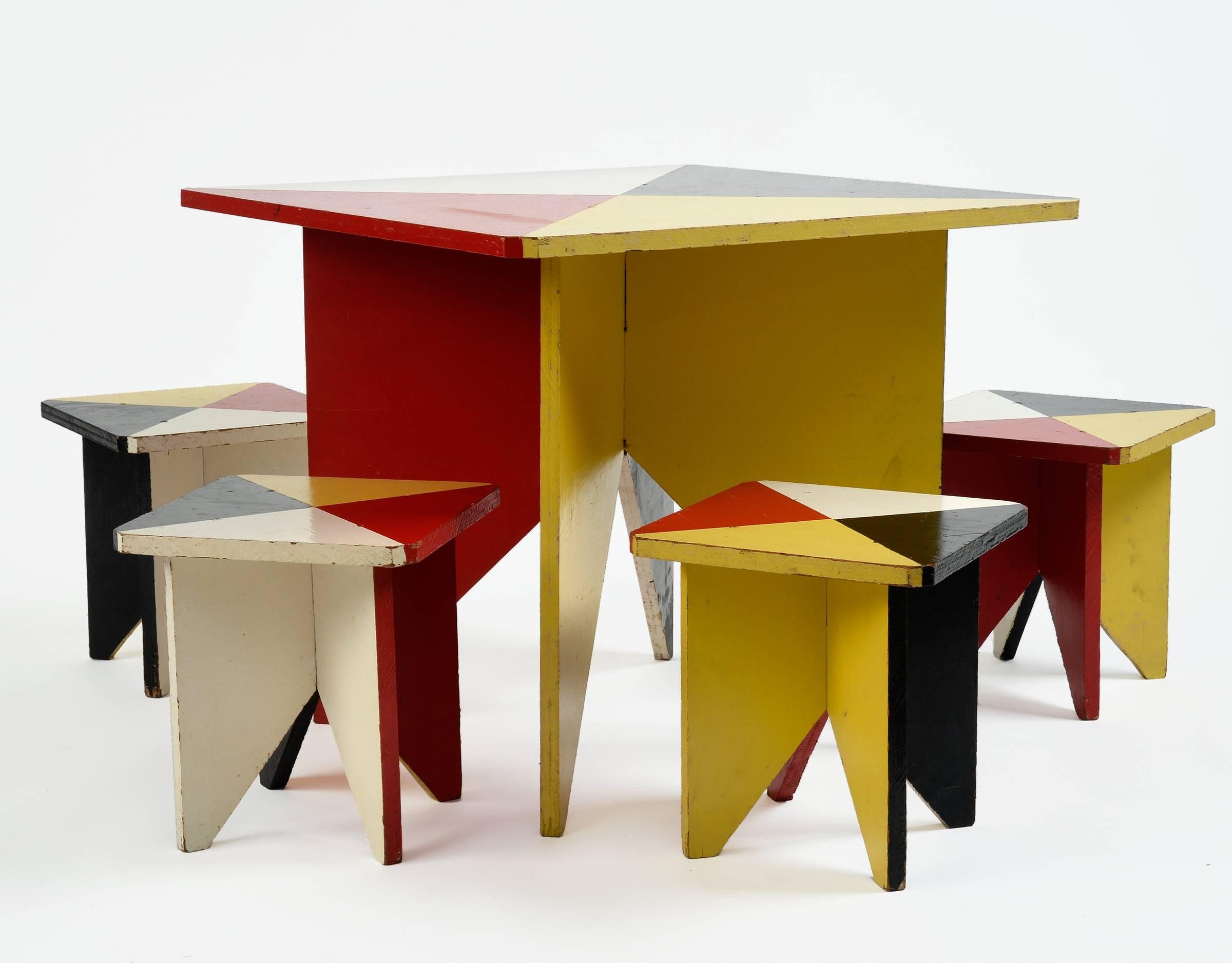What a fun table you are viewing. If you have a modernist home and looking for the perfect game table for the kids to play at, this is it! This set was obtained in Germany and built in 1952 by a father for his two children and their friends. Its