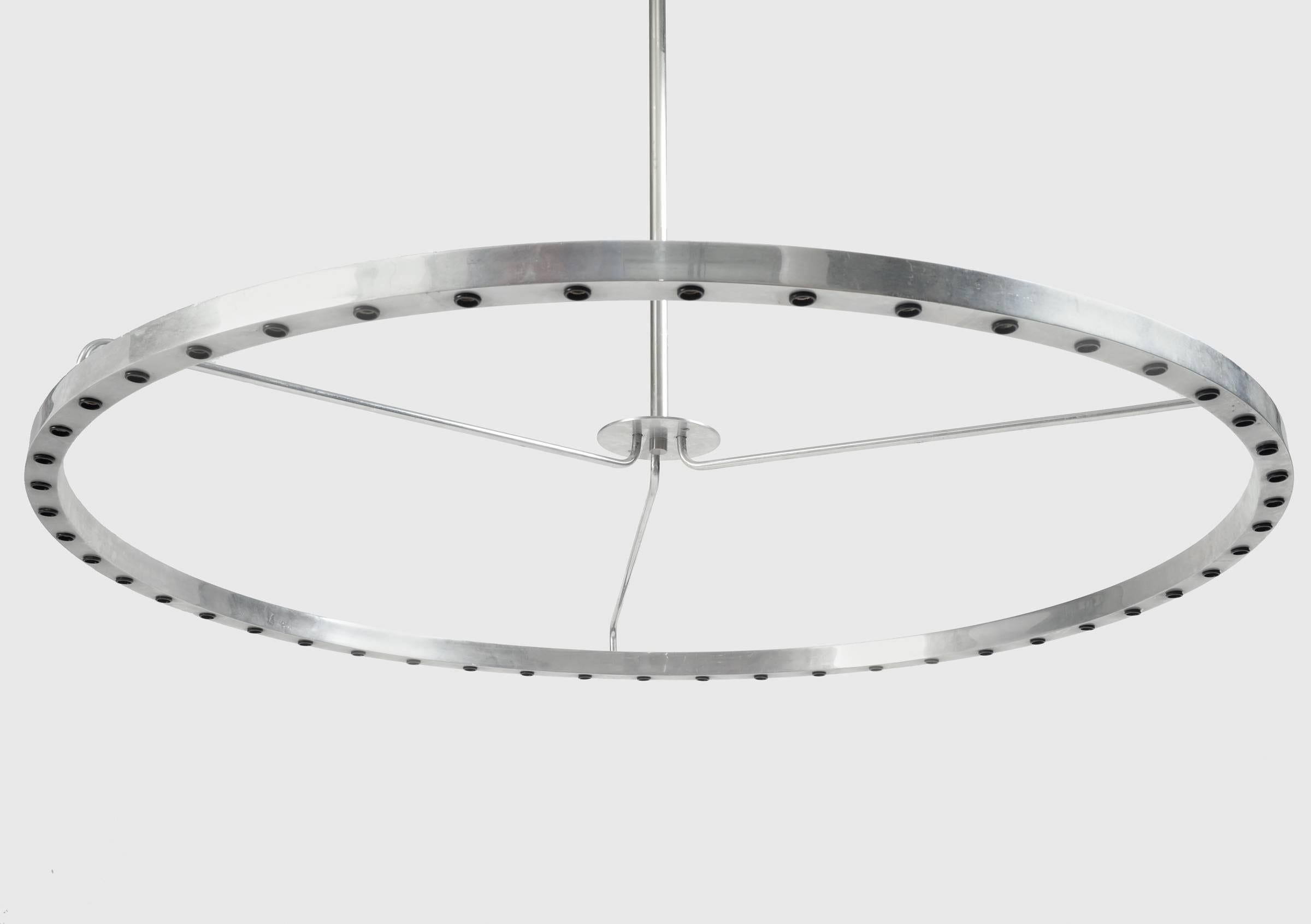 If you want a Minimalist design, this is it for a chandelier. Constructed of aluminium with 48 sockets, yes 48! It would look outstanding with opaque round bulbs or silver reflectors. Absolutely put this chandelier on a dimmer! It is 49 inches wide.