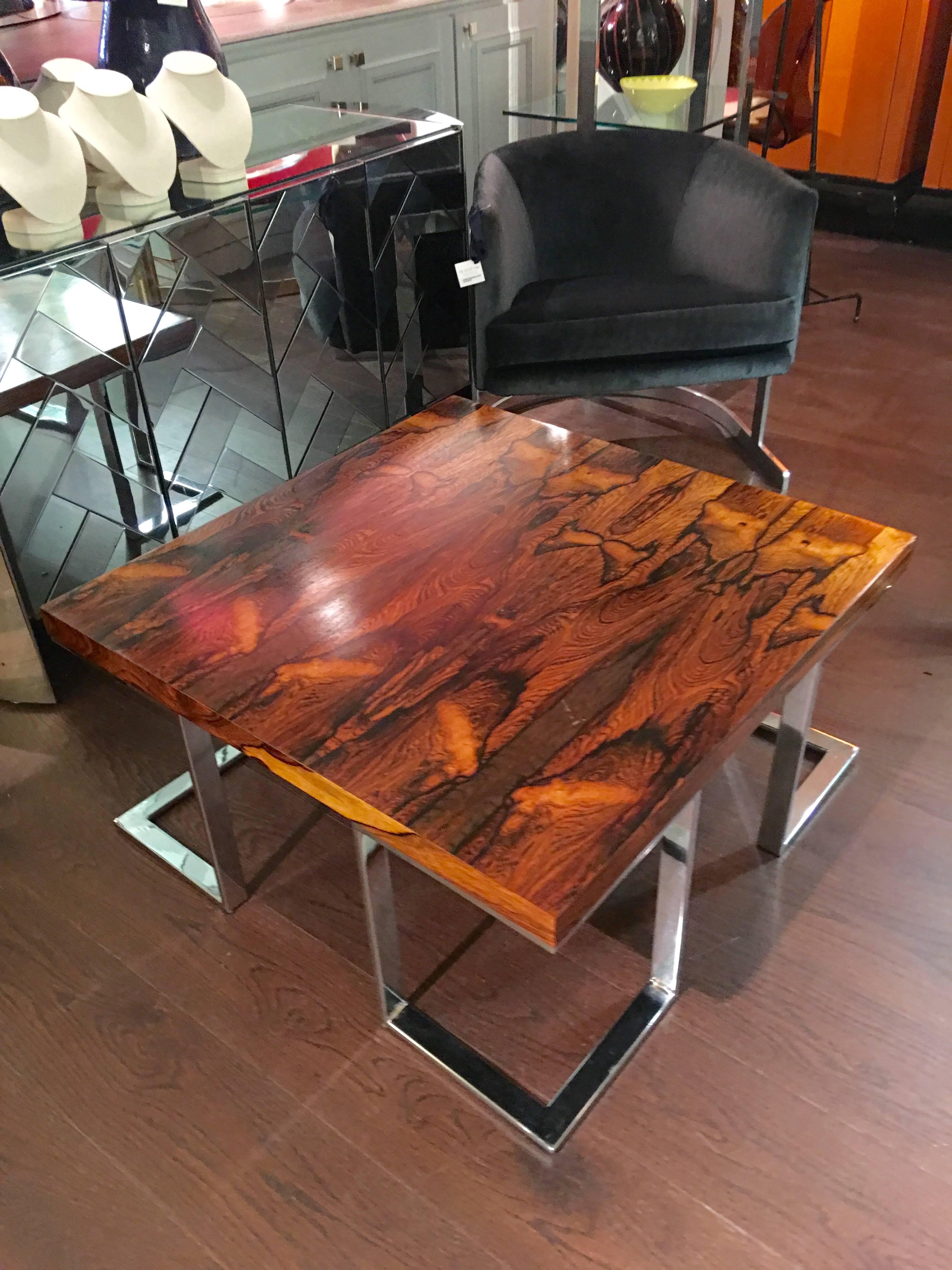 A beautiful Milo Baughman coffee table with chrome base and richly grained rosewood top, circa 1960s.