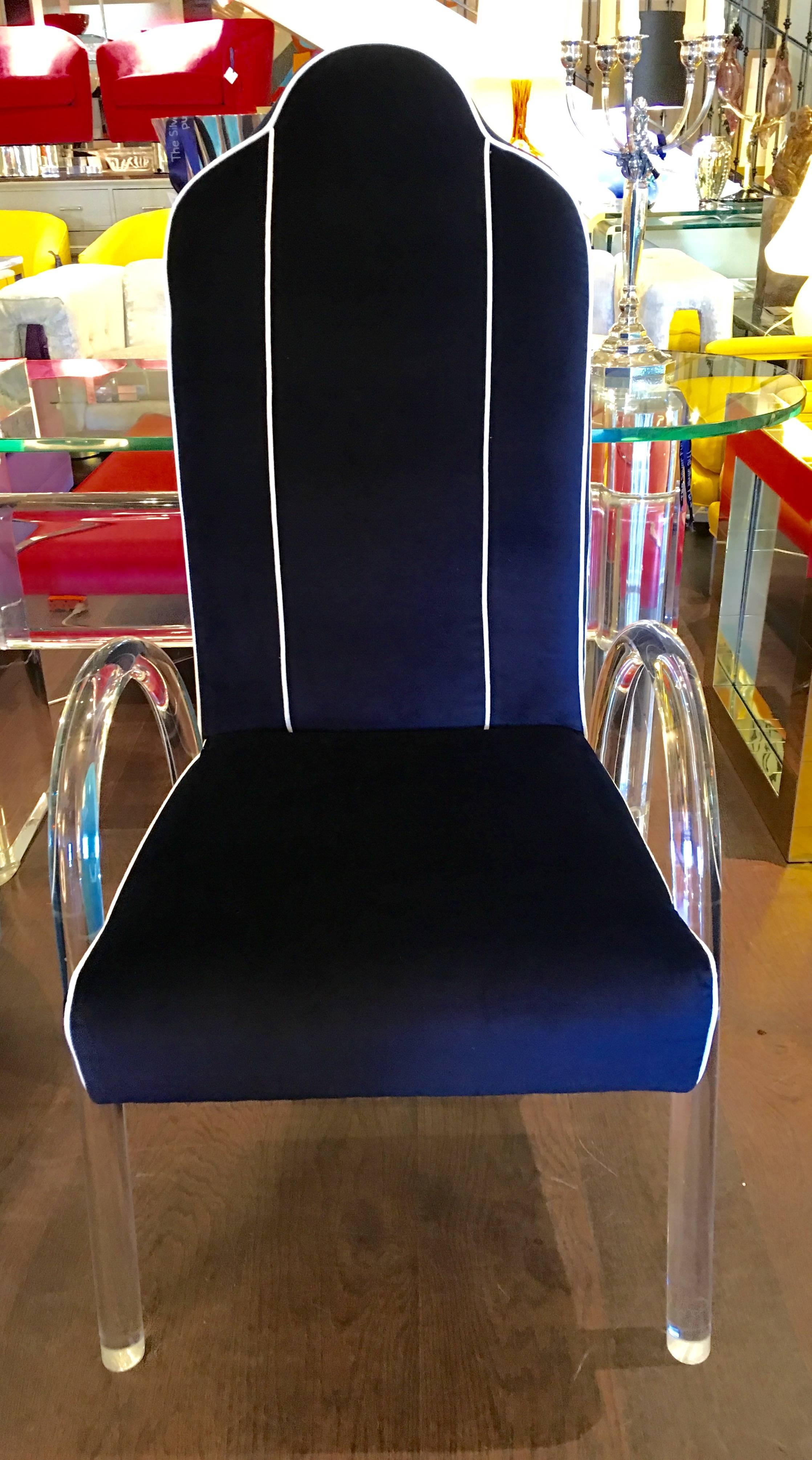 A set of six dining chairs by Charles Hollis Jones, produced circa 1970s, with frames and curved waterfall legs in Lucite, newly upholstered in dark blue velvet fabric with white piping. They show like new.