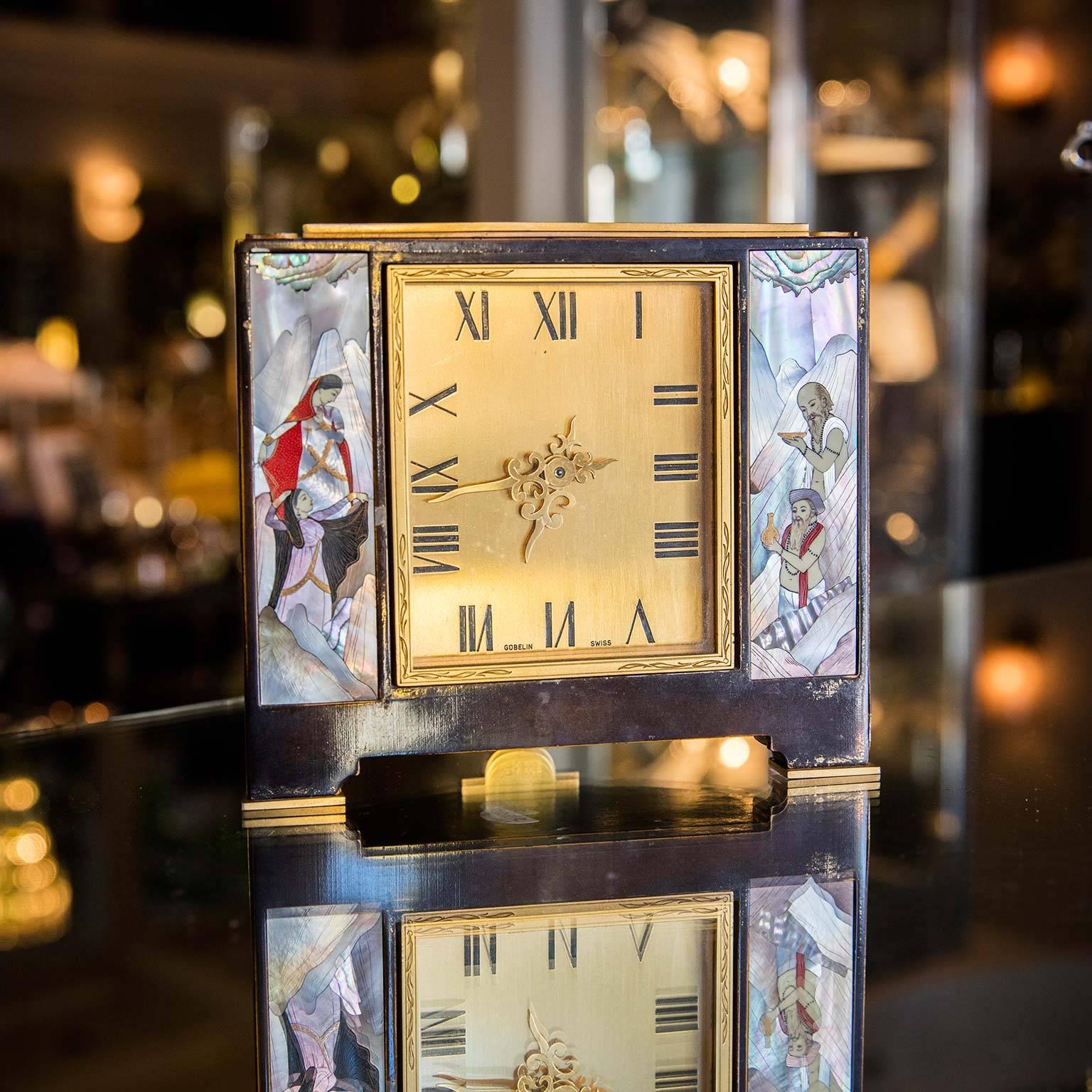 A rare Gubelin clock with inlay mother-of-pearl depicting flirtatious Indian fable.