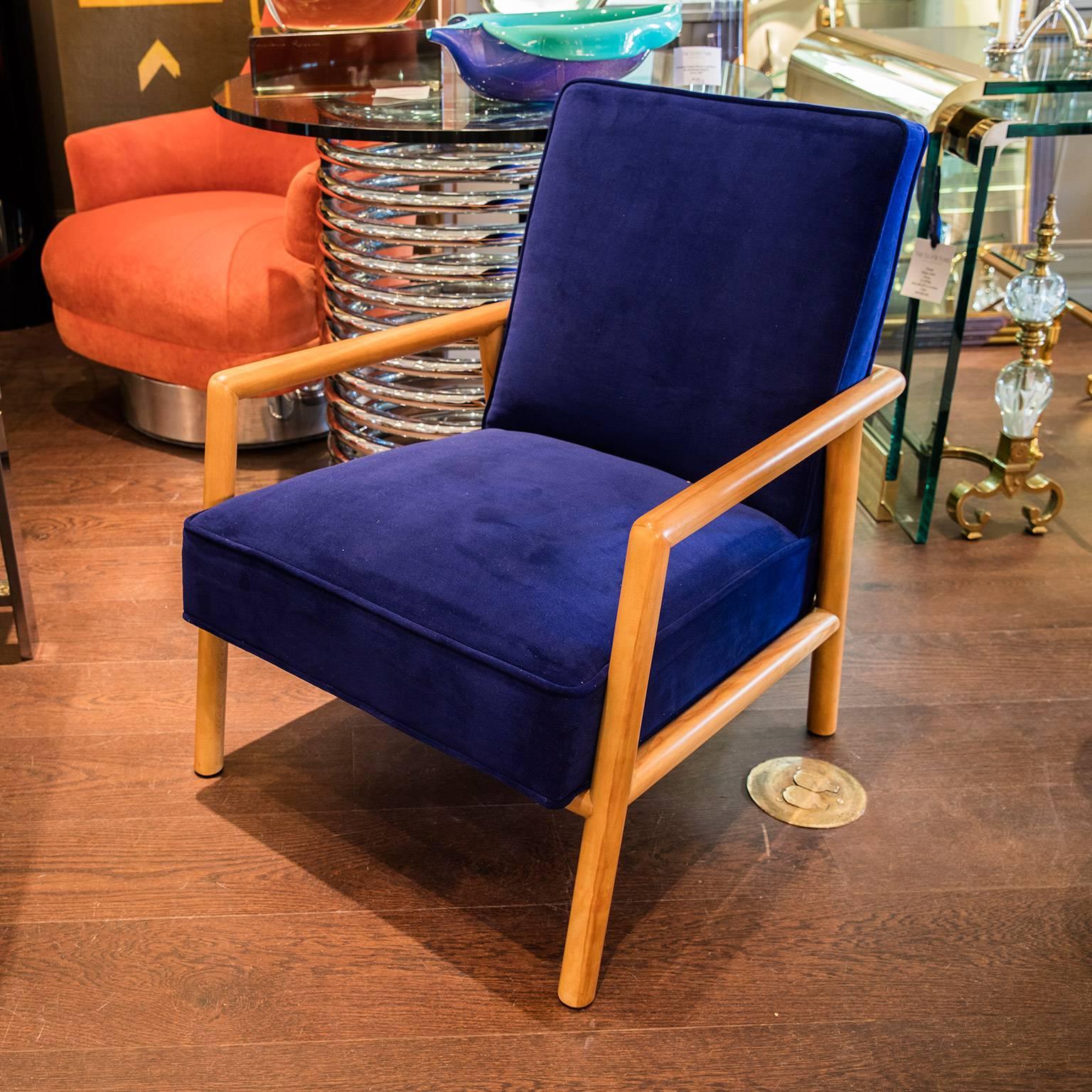 Pair of T.H. Robsjohn-Gibbings blue lounge chairs with original wood finish in excellent condition. Newly upholstered in a vibrant blue material.
