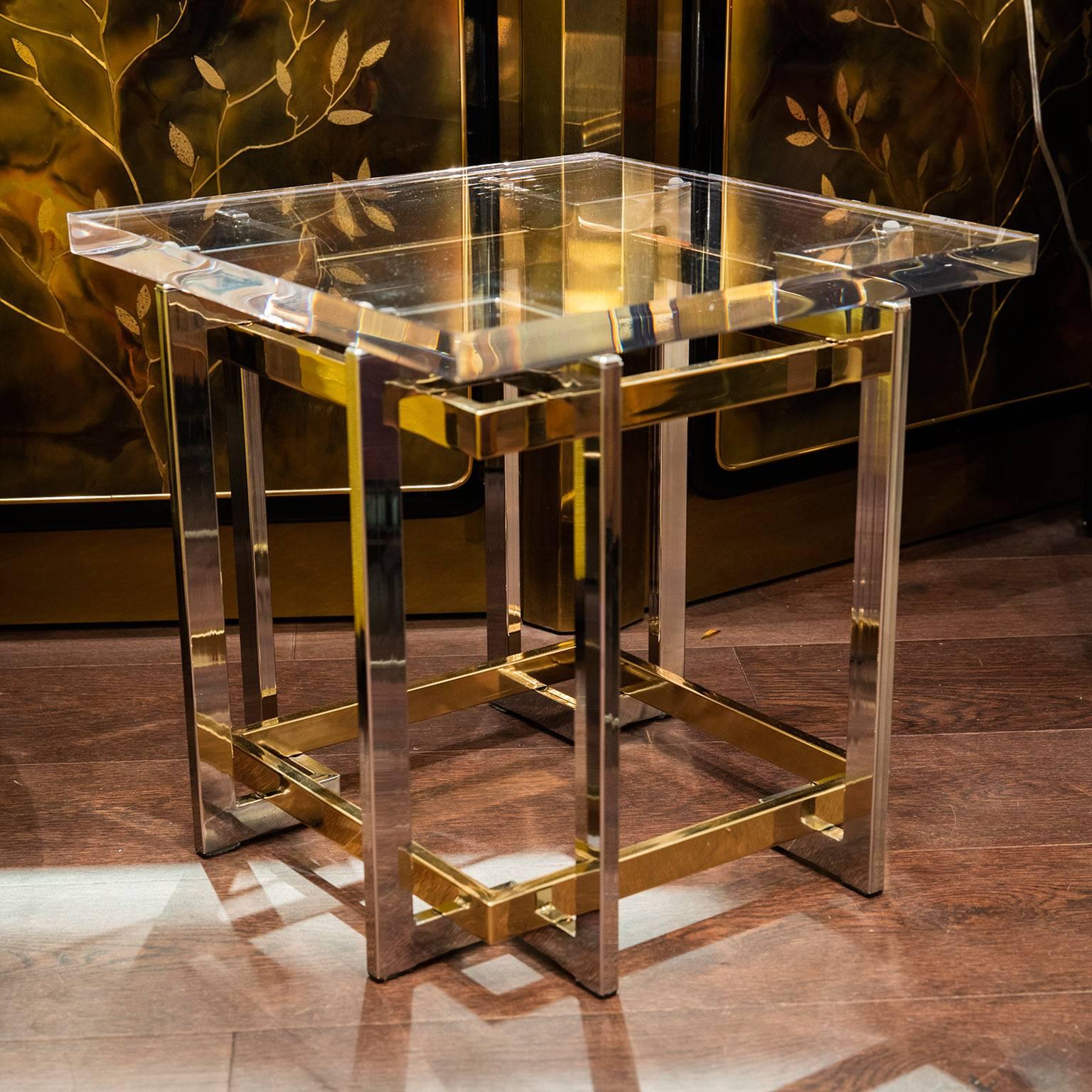 A pair of sculptural Pierre Cardin petite end tables with thick Lucite top.