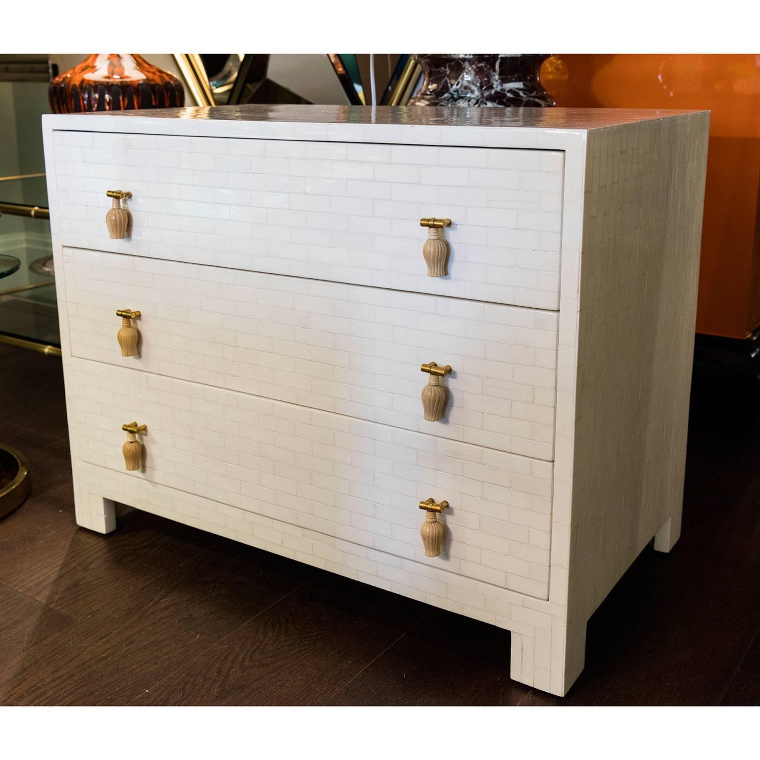 A pair of fabulous three-drawer end chests with bone inlay on wood resin.