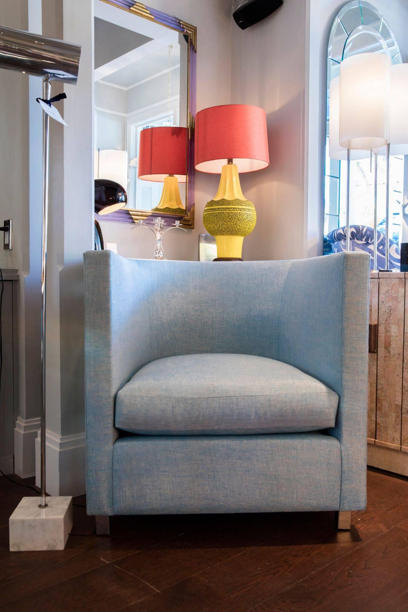 Pair of fabulous chrome barrel club lounge chairs newly reupholstered in light blue material.