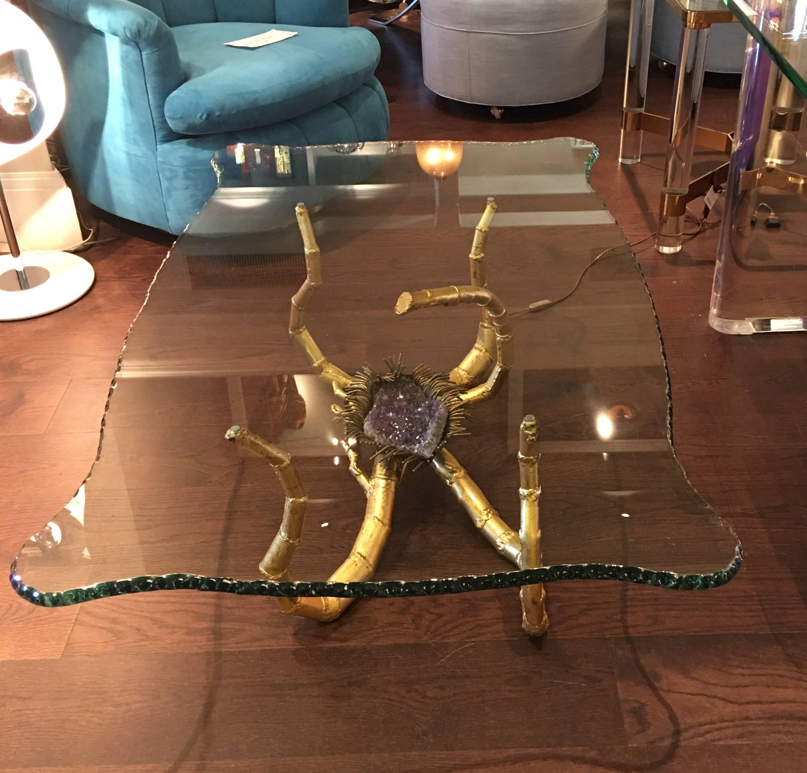 Very rare Jacques Duval coffee table with metal brass color frame and amethyst. The table is illuminated by a light integrated in one of the metal bamboo frames that shines right over the amethyst, circa 1970s.