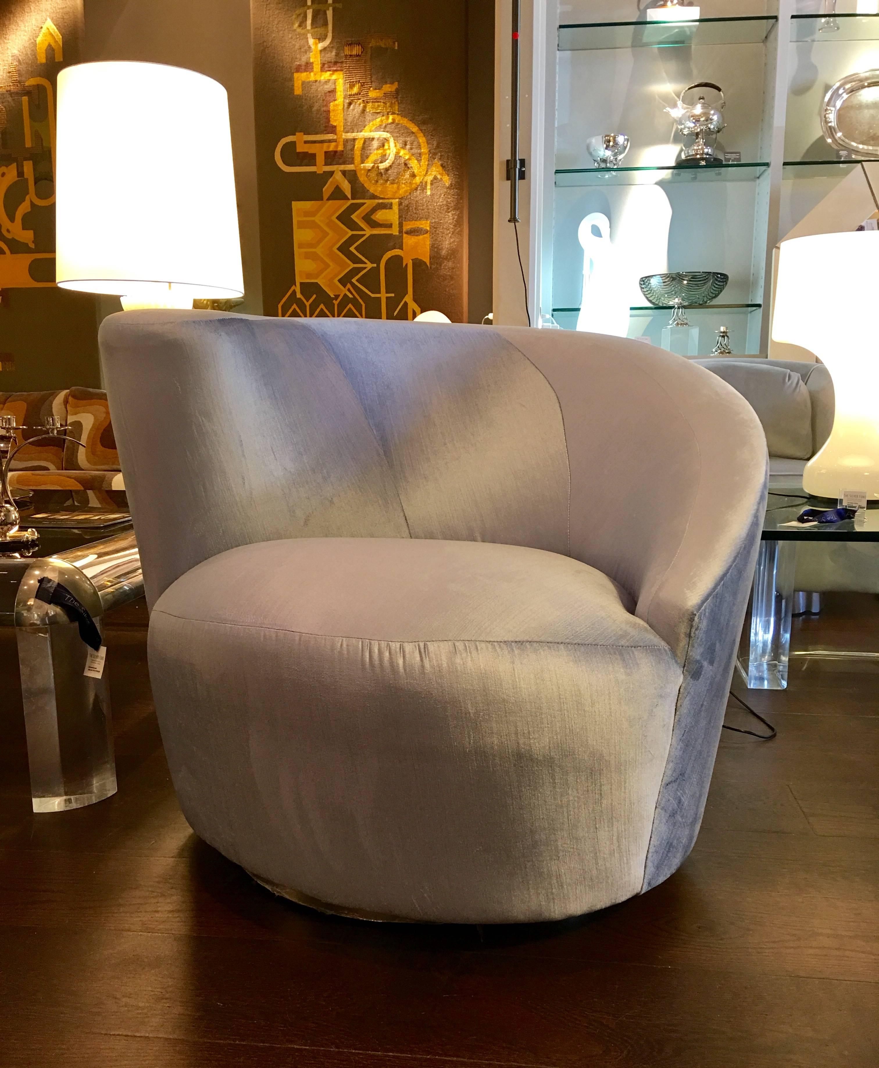 A pair of powder blue ultra-suede Nautilus chairs by Vladimir Kagan. Both chairs have smooth range of motion, as they swivel and return to center position and both have been fully restored with new chrome bases.