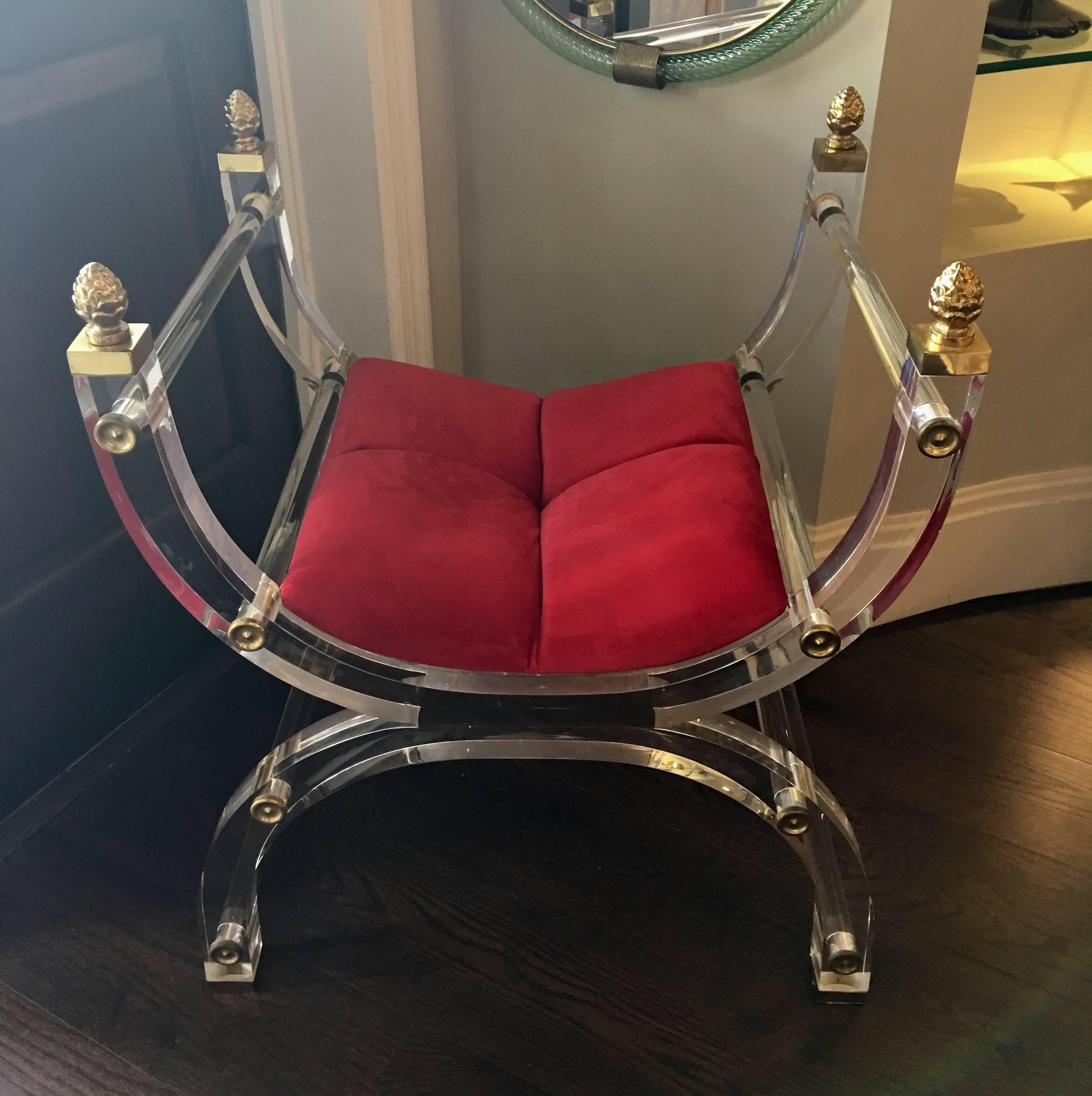 Rare Lucite X form throne or vanity chair. Newly upholstered in a wonderful red vibrant fabric, circa 1970s.