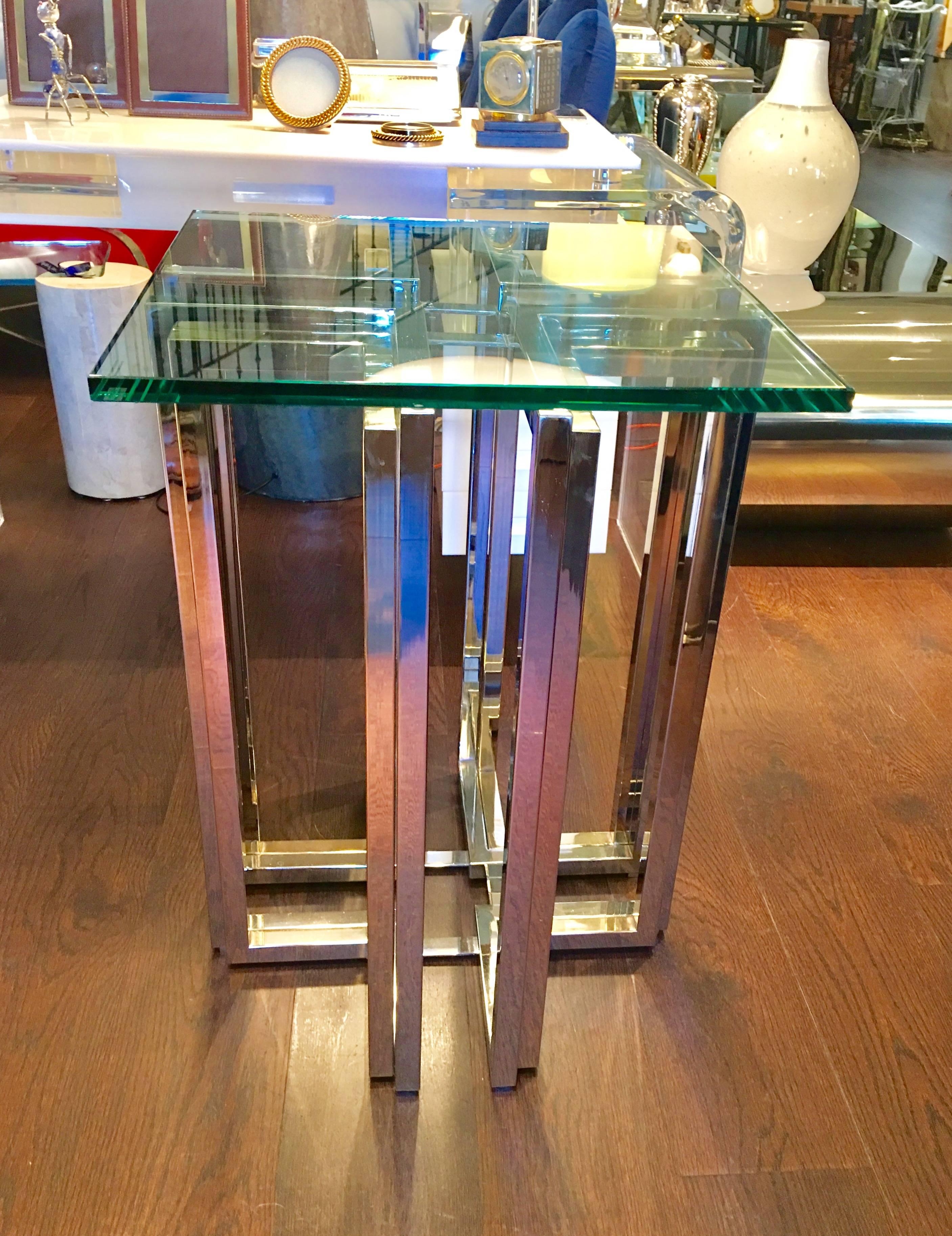 A wonderful pair of sculptural based in polished brass and chrome end tables by Pierre Cardin, circa 1970.