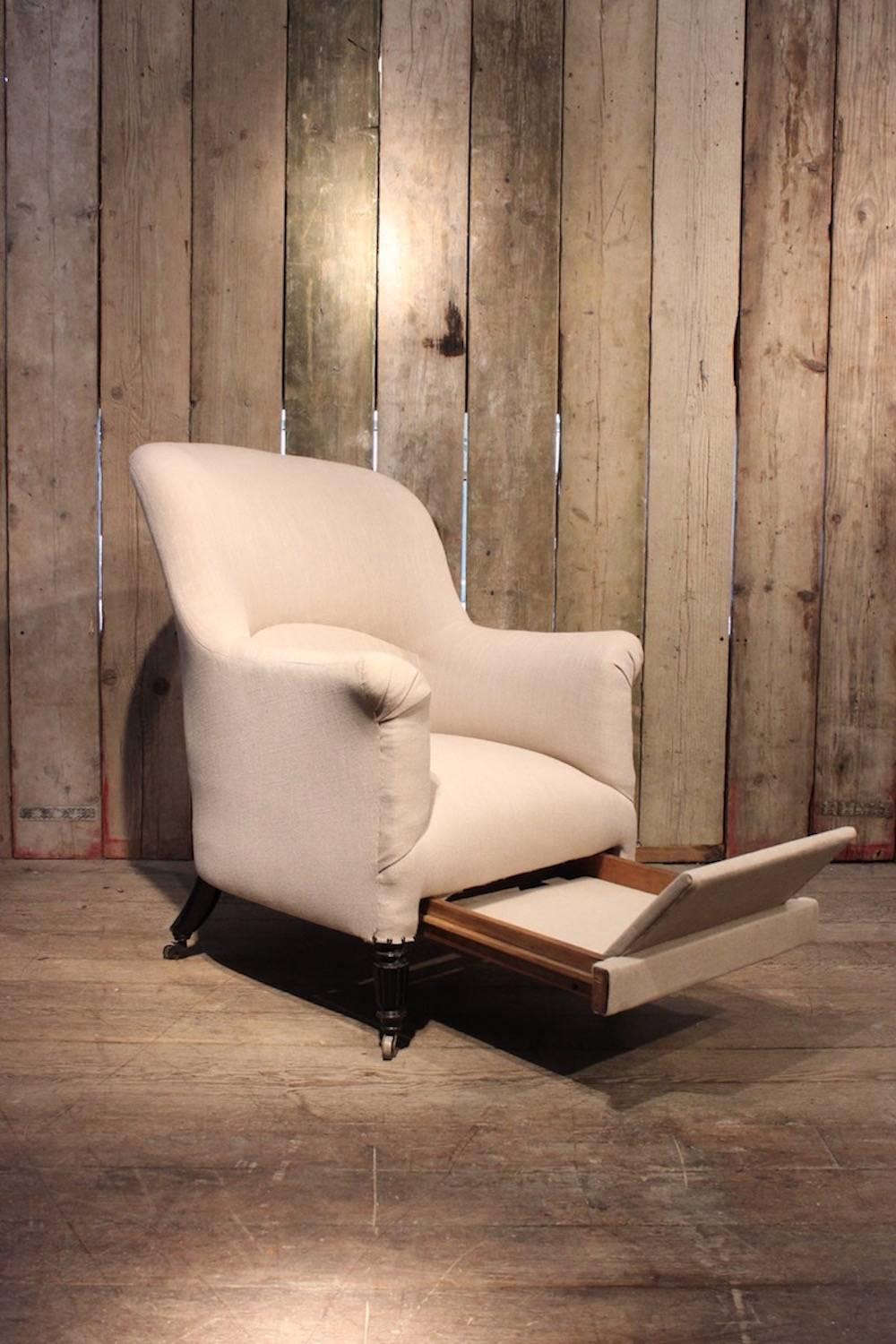 A Napoleon III ebonised and upholstered bergere armchair with a retractable metamorphic footstool, French, circa 1880.