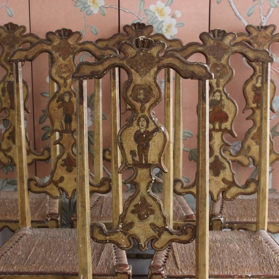 A wonderful set of six Spanish painted dining chairs in the 18th century Italian taste. Attributed to Pierre Lotier. Retaining the original rush seats and decoration. Will make a statement in most settings.