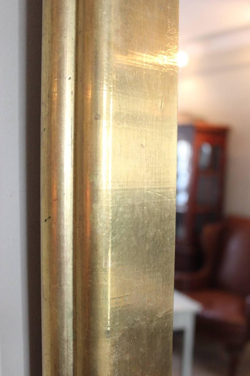 A good and decorative pair of polished brass rectangular mirrors in the style of Rodolfo Dubarry, Spanish, 1970s.